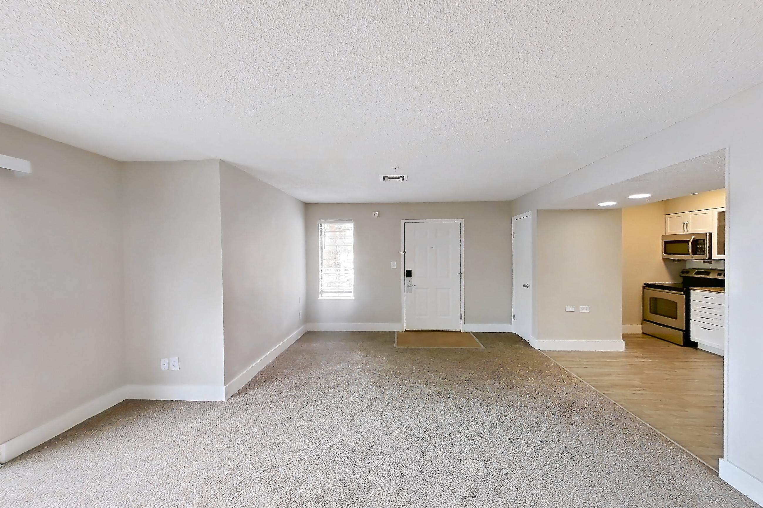 Living space with oven/range and stainless steel appliances, Apartment 1022 at Pelican Lake