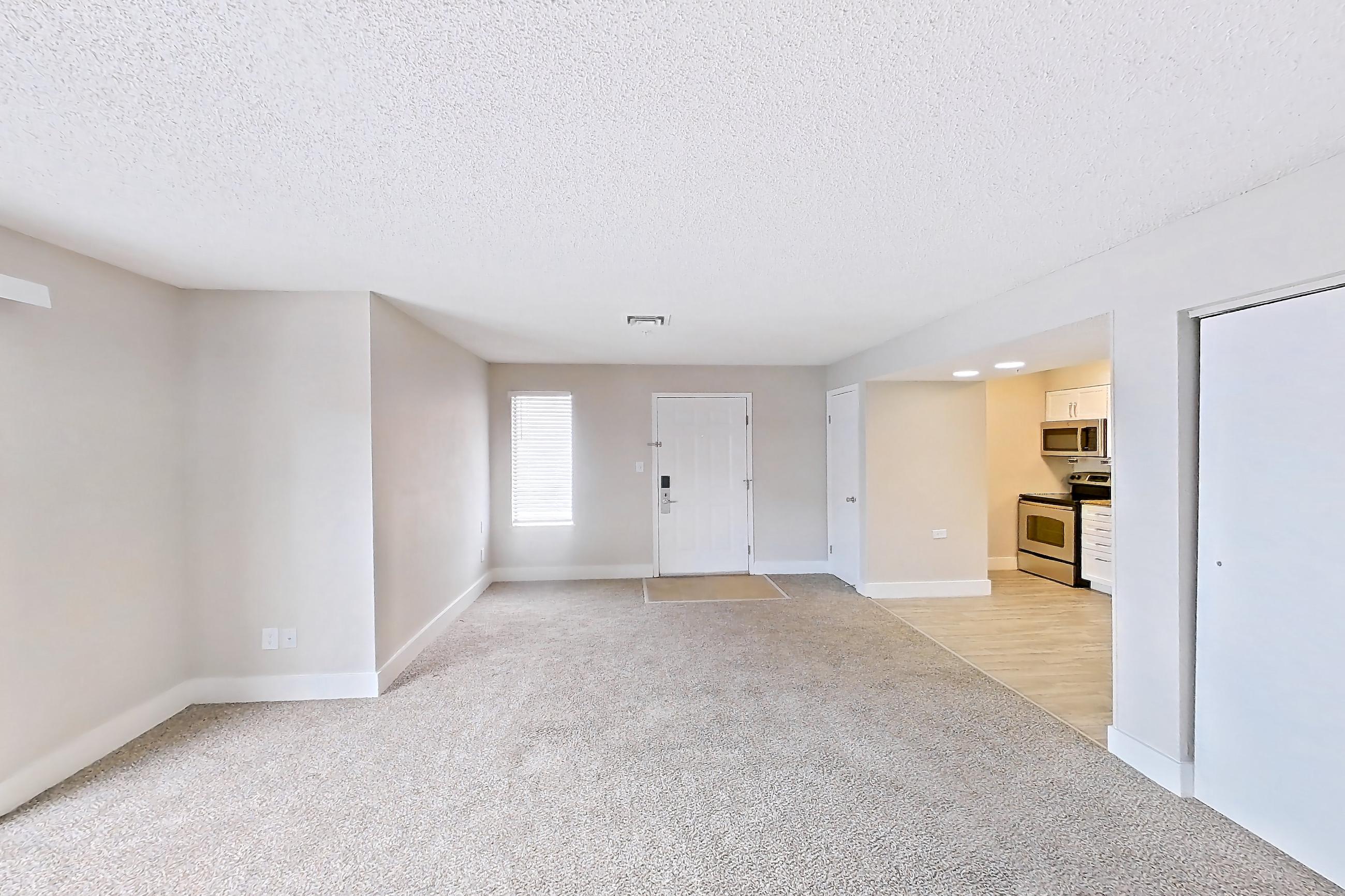 Living space with electric range, light carpet, oven/range, and stainless steel appliances, Apartment 824 at Pelican Lake