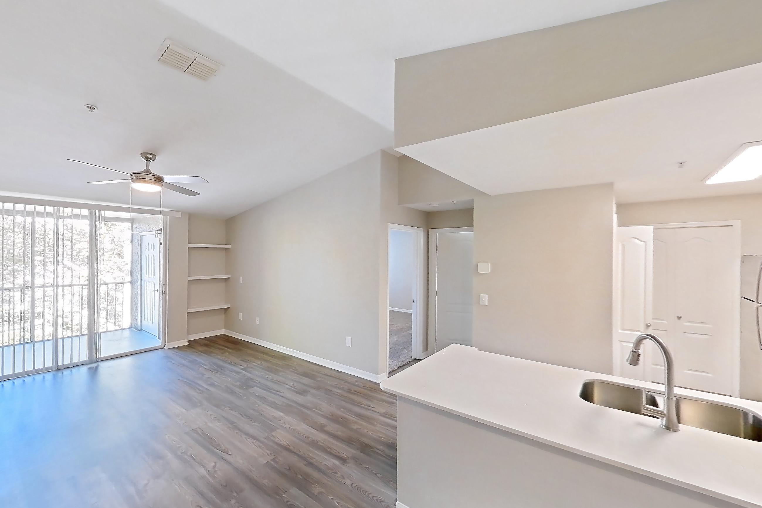 Dining room with dark wood-finish flooring, electric range, and light countertops, Apartment 02-301 at Boot Ranch