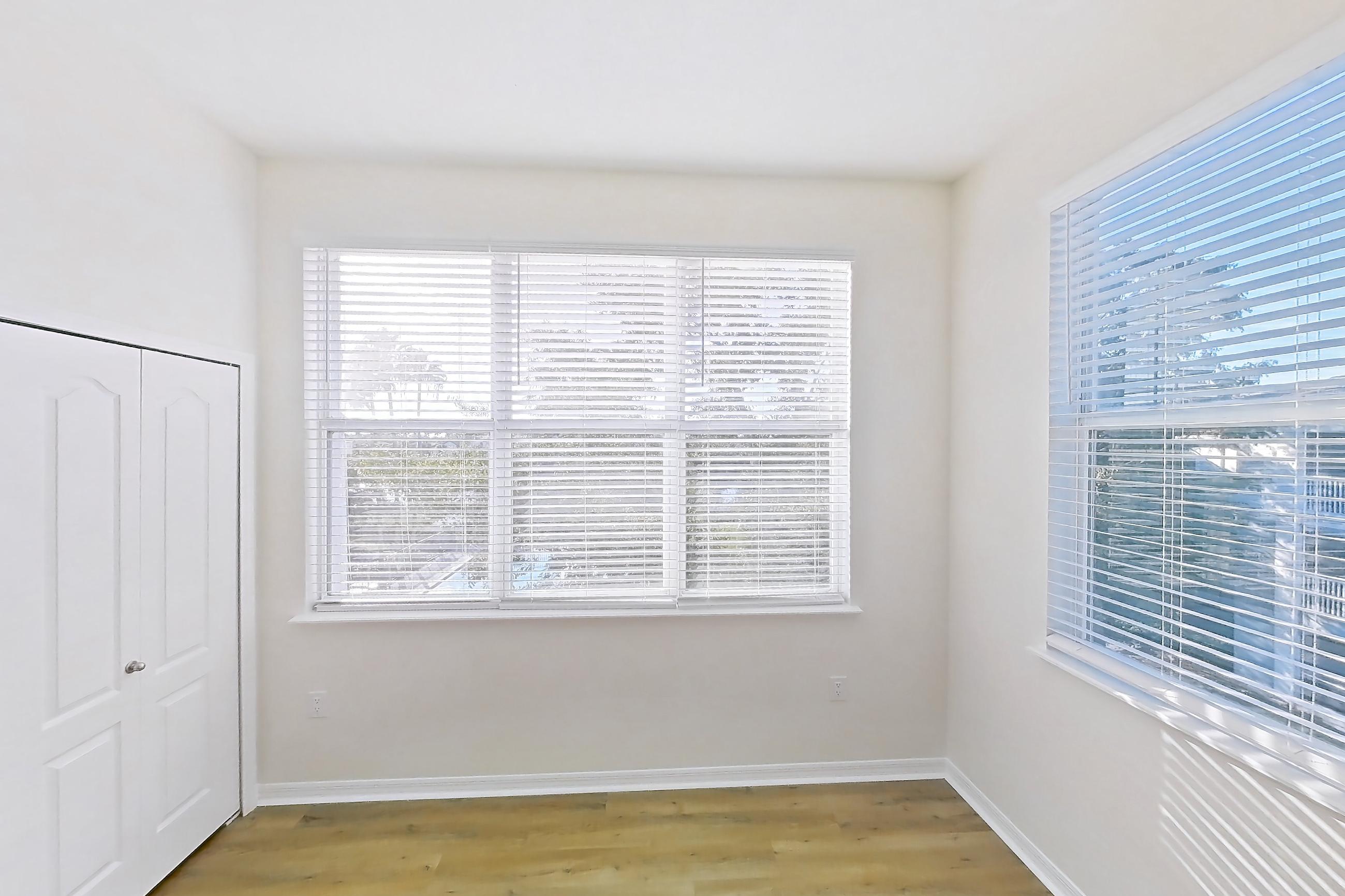 Living room with light wood-finish flooring, Apartment 15-308 at Boot Ranch
