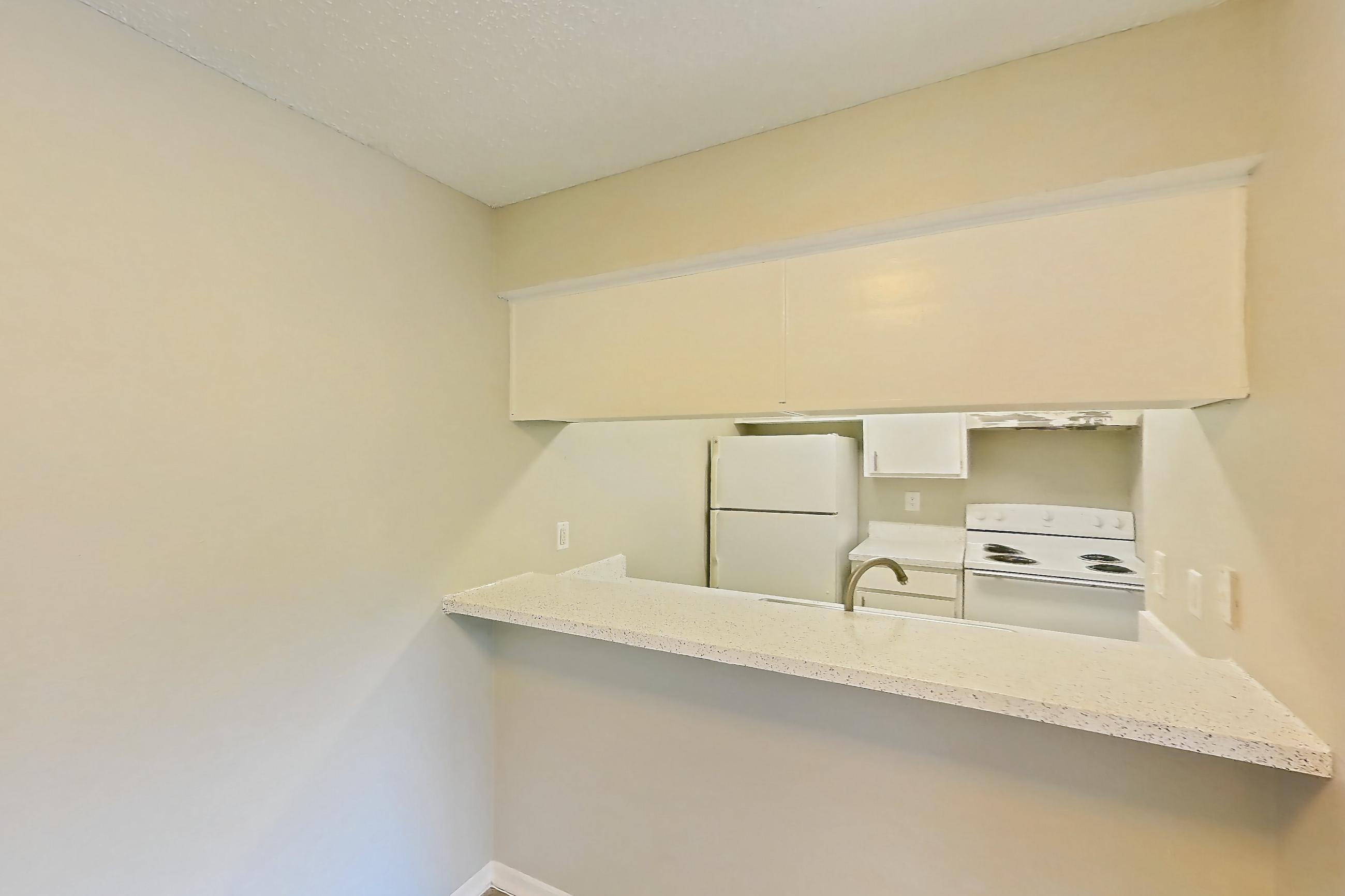 Dining room with electric range, light stone countertops, light wood-finish flooring, oven/range, refrigerator, and white appliances, Apartment 1008 at Westgate