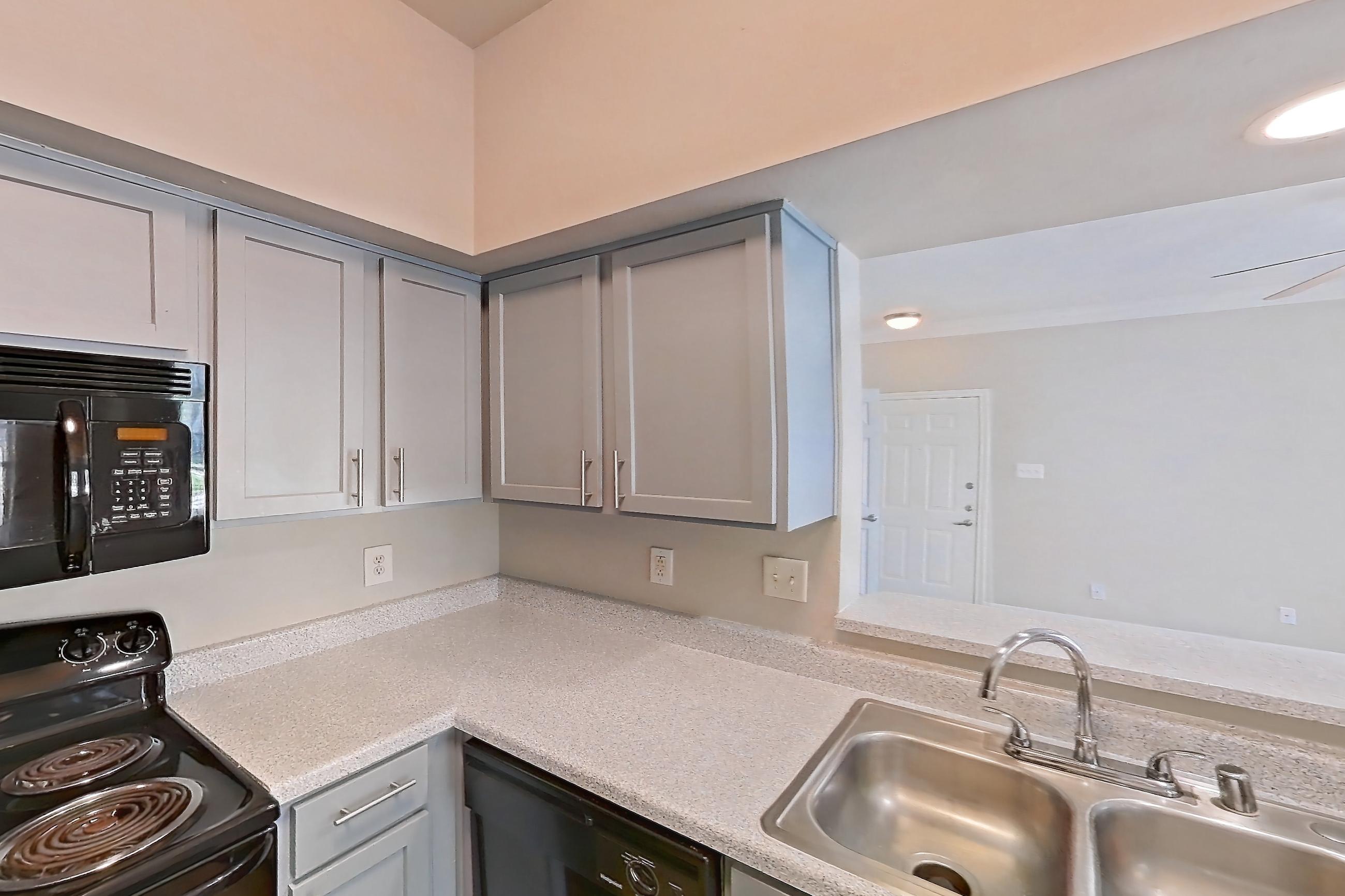 Kitchen in a 2 Bedroom - 1 Bath floor plan unit, representative of Unit 0207 at Champions Park
