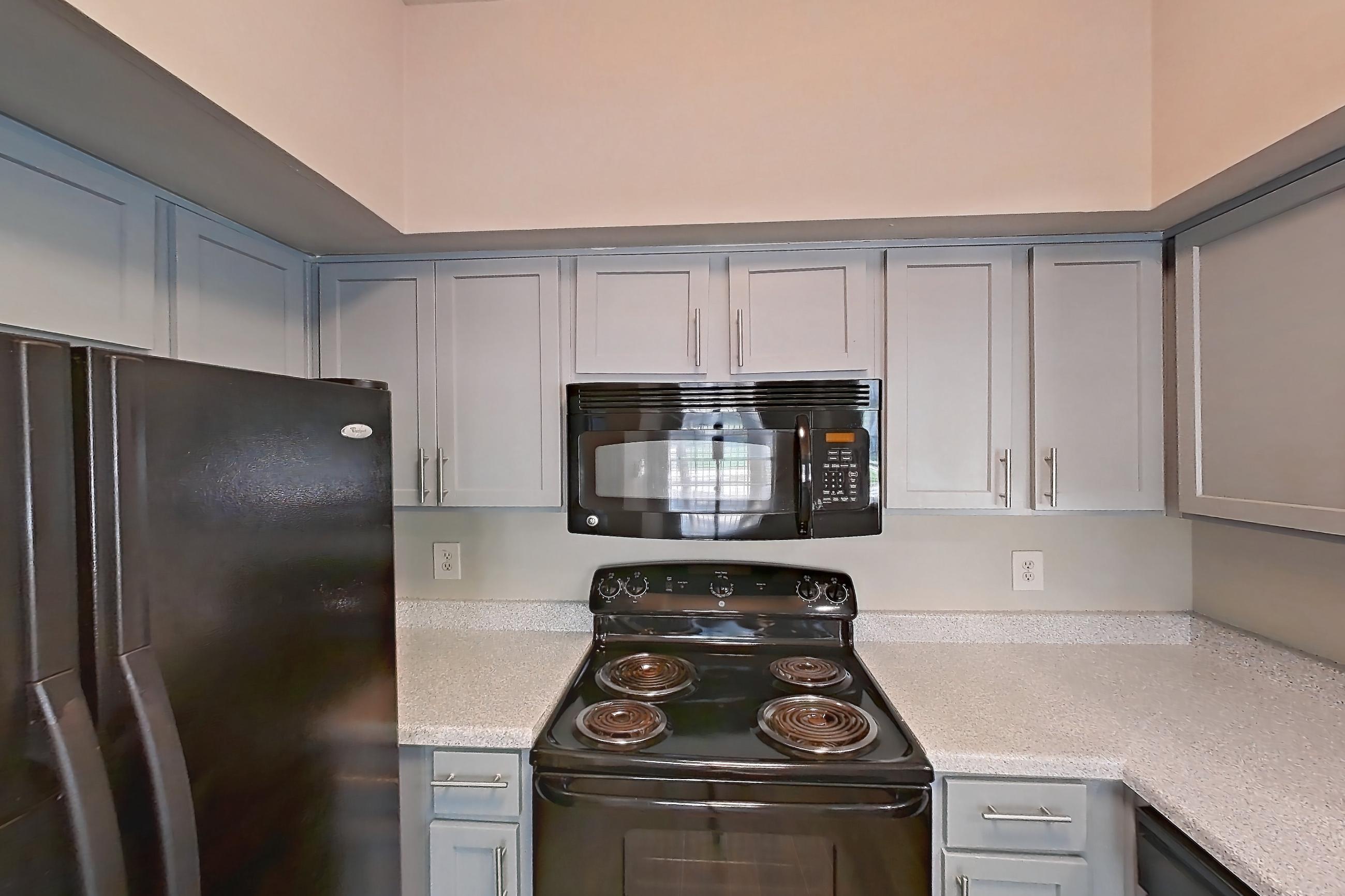Kitchen in a 2 Bedroom - 1 Bath floor plan unit, representative of Unit 0207 at Champions Park