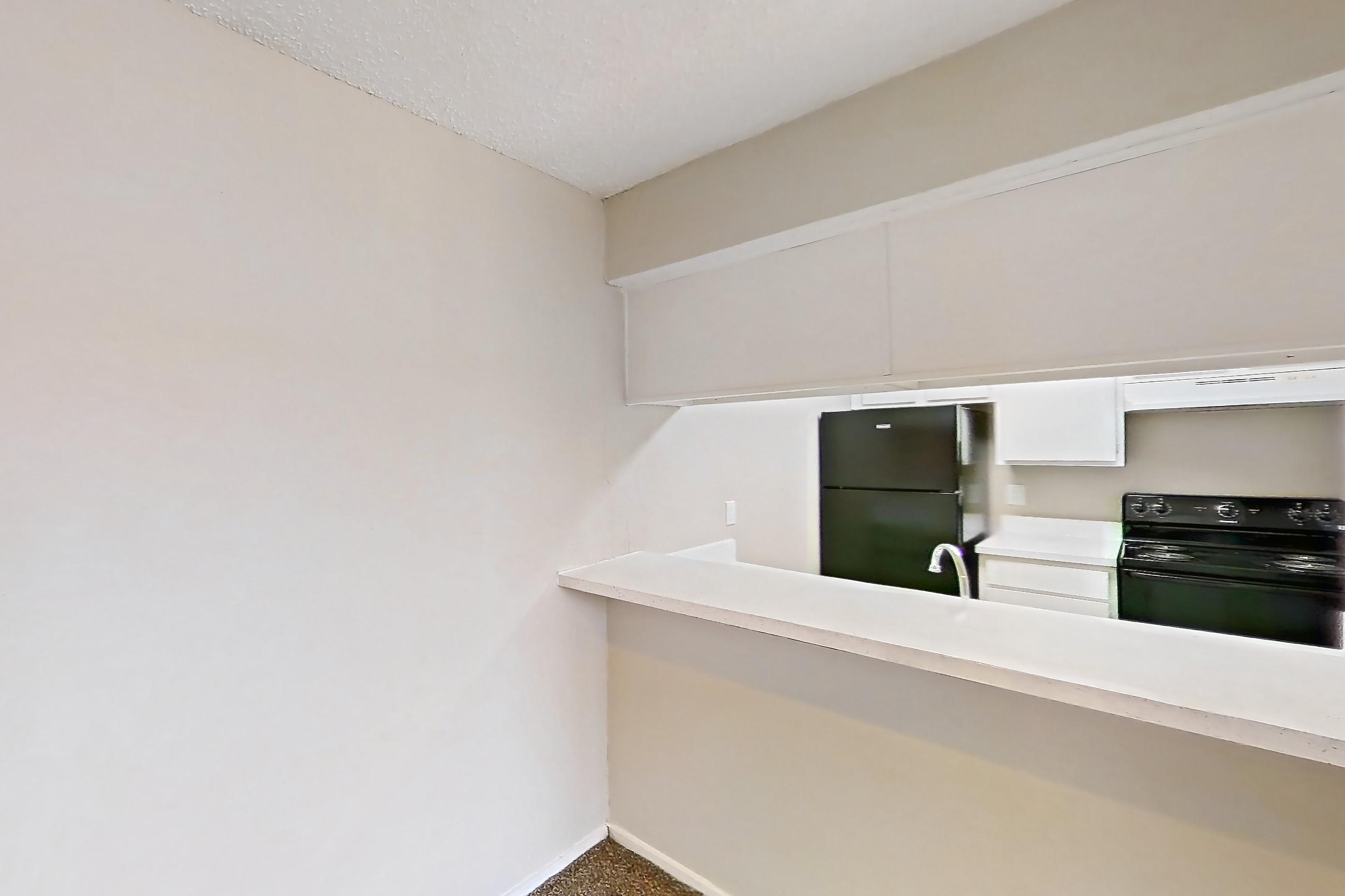 Dining room with black appliances, electric range, oven/range, and refrigerator, Apartment 601 at Westgate