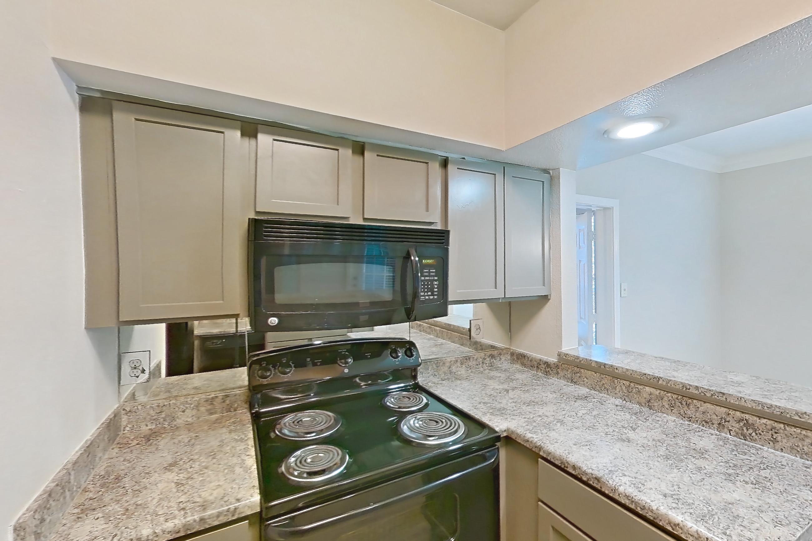 Kitchen in a 1 Bedroom - 1 Bath floor plan unit, representative of Unit 0405 at Champions Park