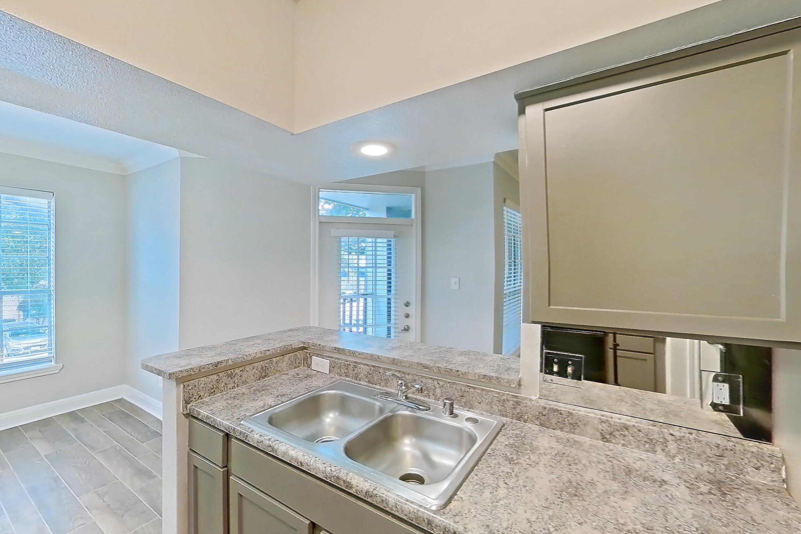 Kitchen in a 1 Bedroom - 1 Bath floor plan unit, representative of Unit 0405 at Champions Park