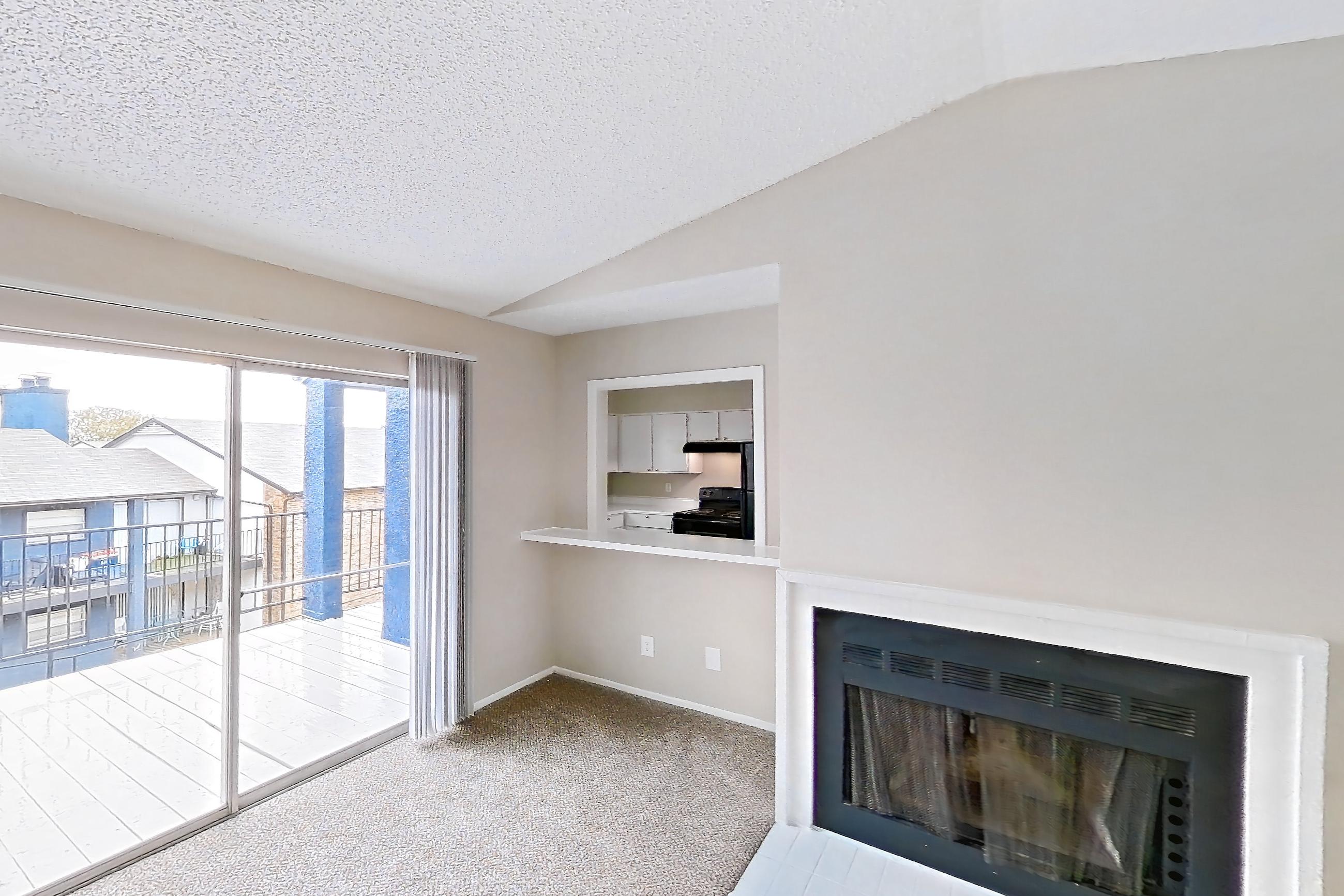 Living room with black appliances, electric range, fireplace, light carpet, and oven/range, Apartment 4104 at Bella Vista