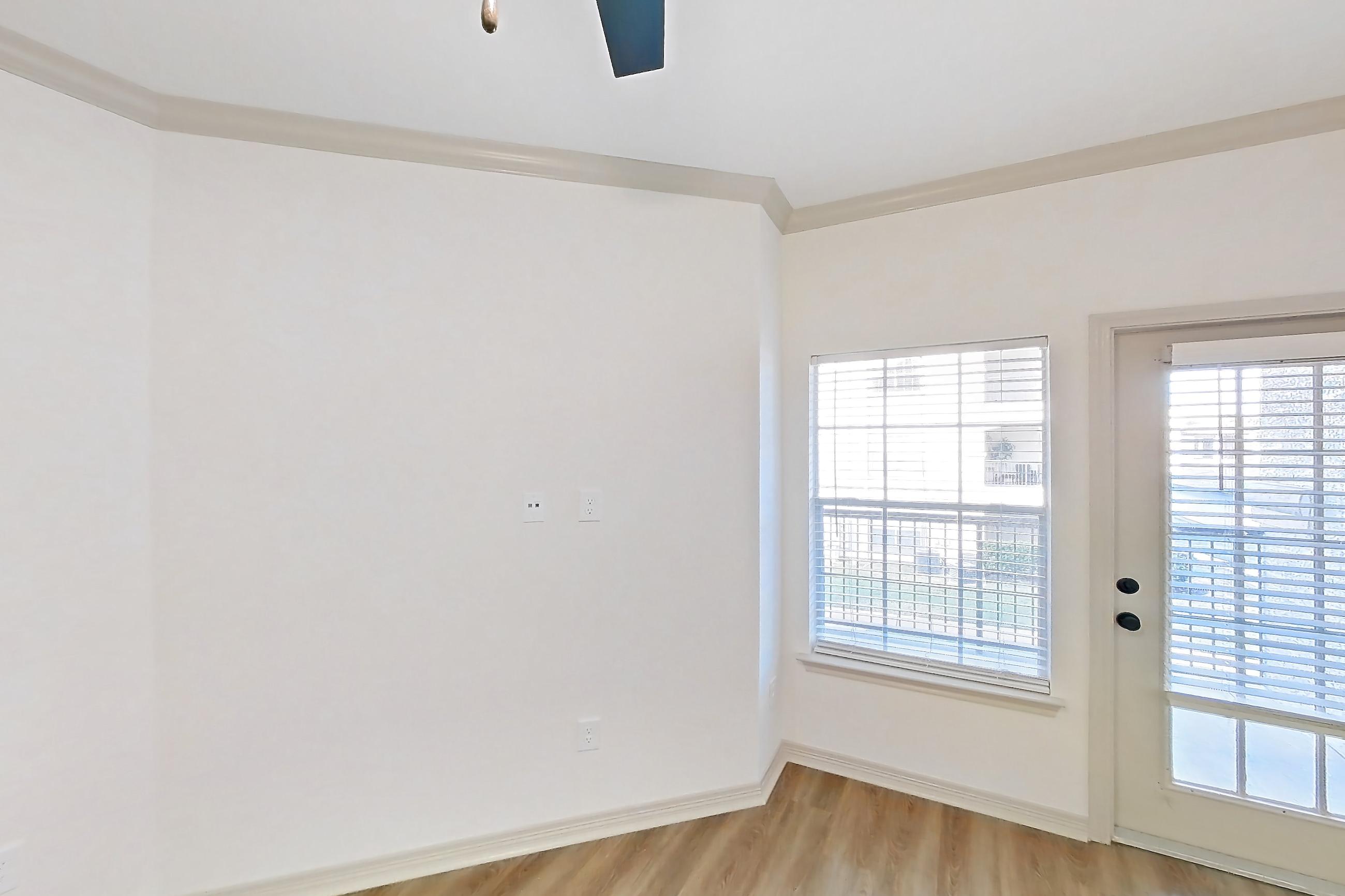 Living room with light wood-finish flooring, Apartment 15204 at Cortland Wortham