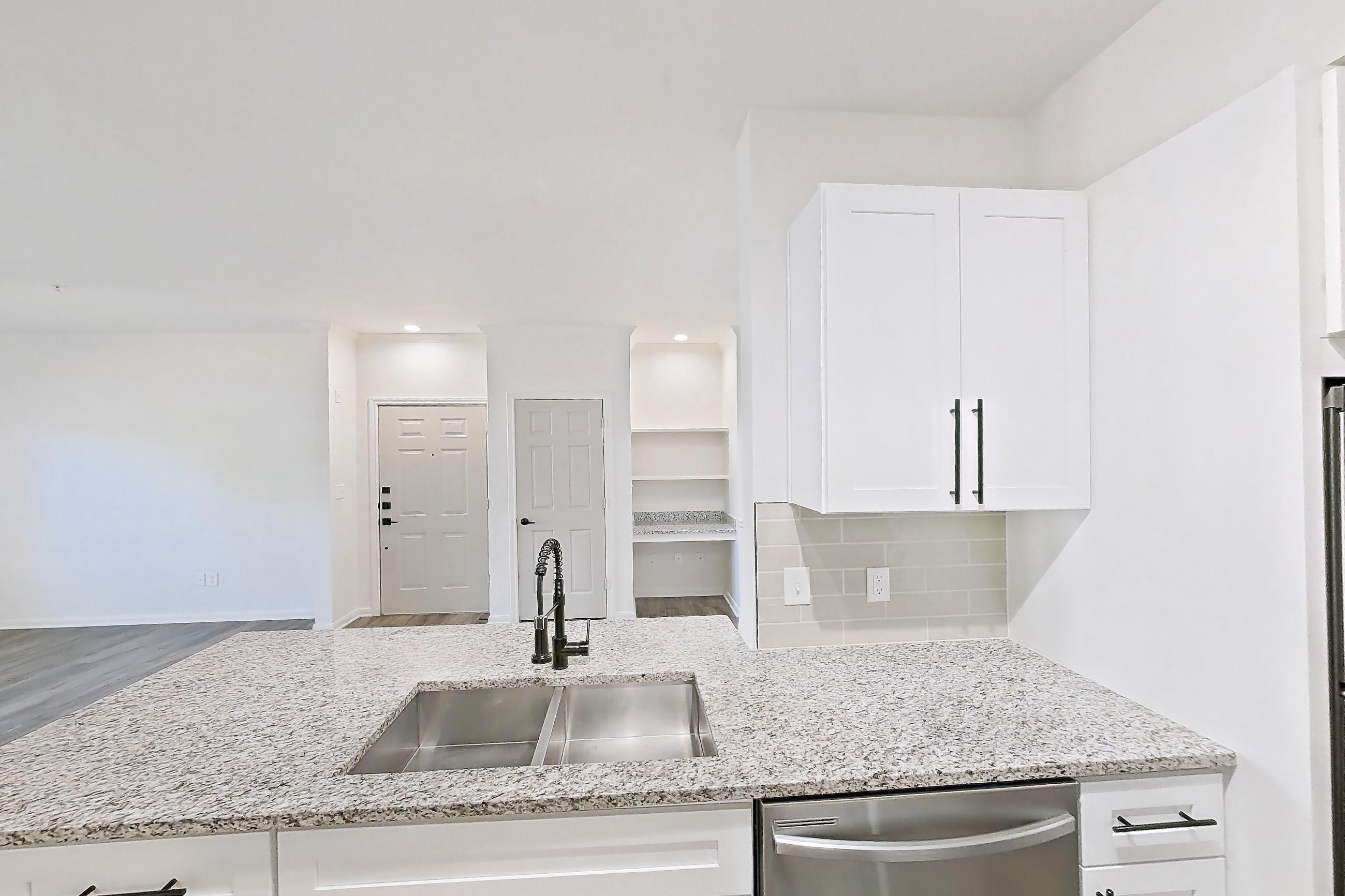 Kitchen in Apartment 7211 at Cortland at Twin Creeks, B1R - The Glendover floor plan