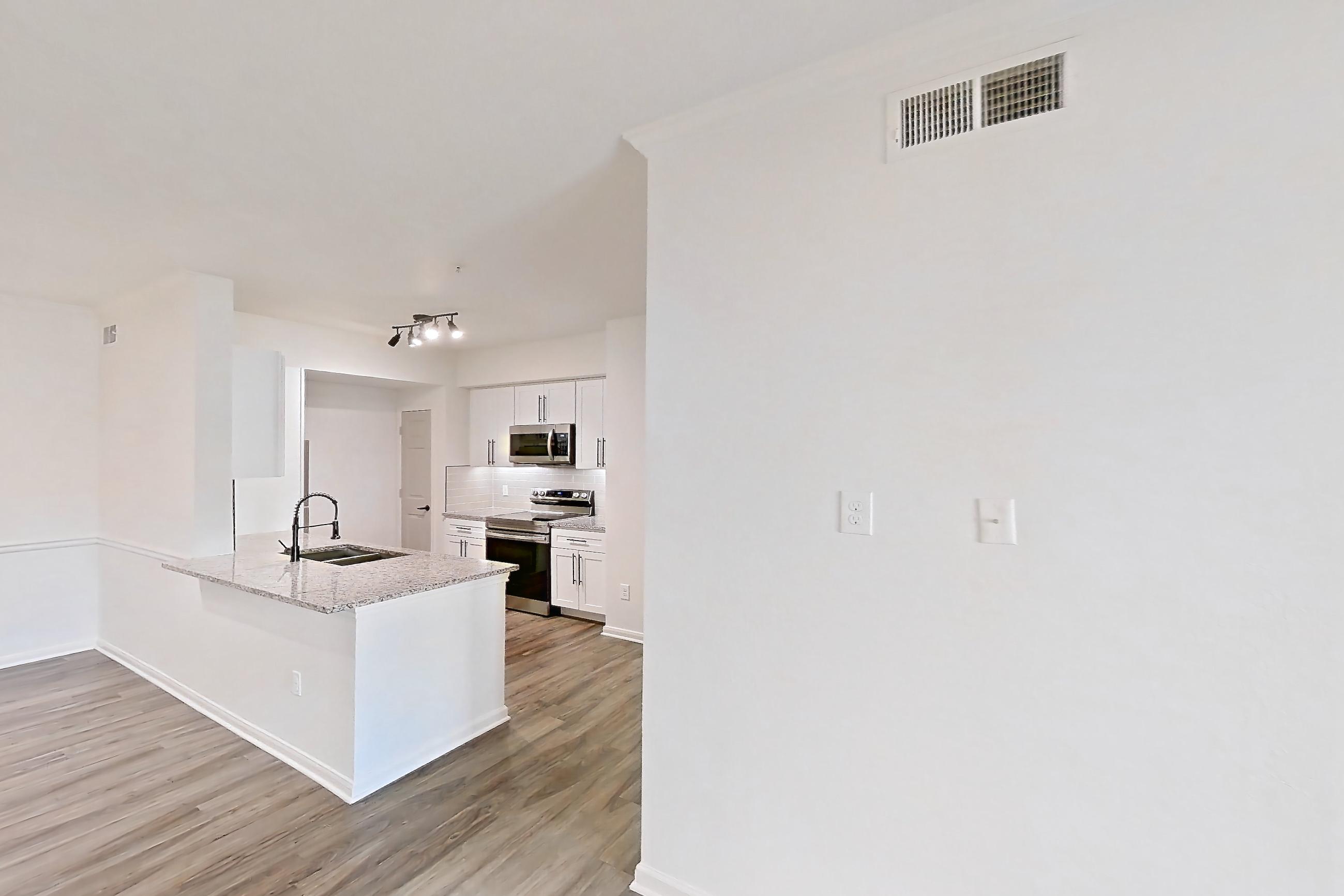 Living room in Apartment 7211 at Cortland at Twin Creeks, B1R - The Glendover floor plan