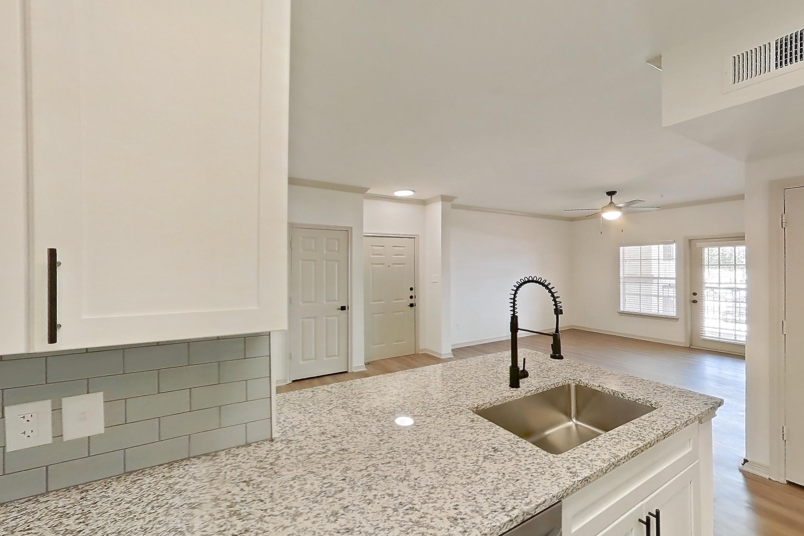 Kitchen in a B1R - Cypress Falls floor plan apartment, representative of Apartment 3307 at Cortland Wortham