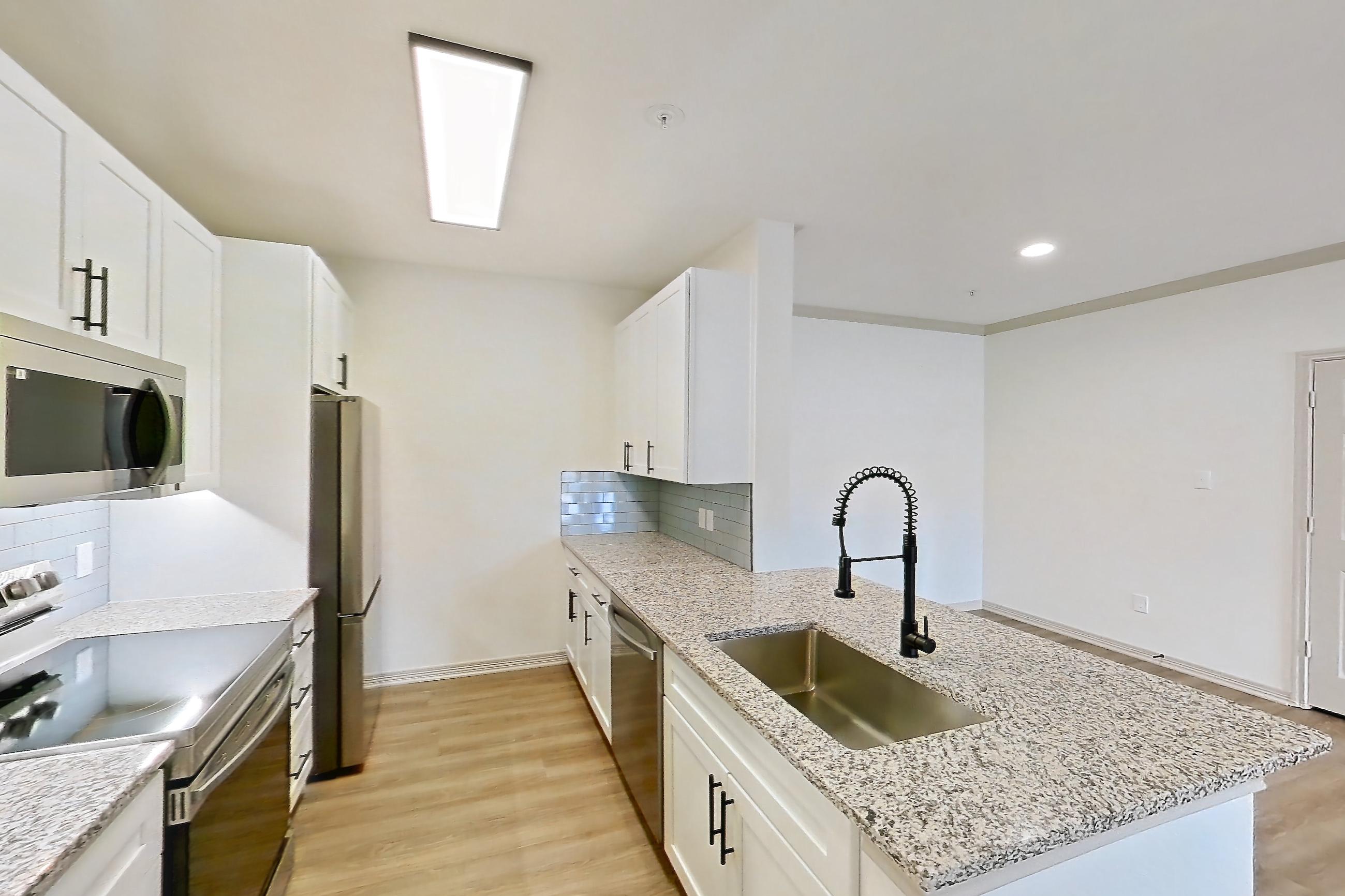 Living space in a B1R - Cypress Falls floor plan apartment, representative of Apartment 3307 at Cortland Wortham
