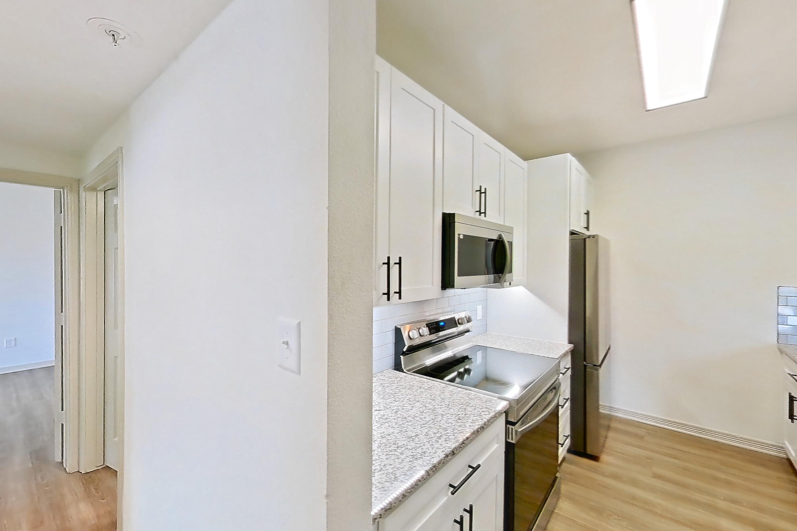 Living space in a B1R - Cypress Falls floor plan apartment, representative of Apartment 3307 at Cortland Wortham