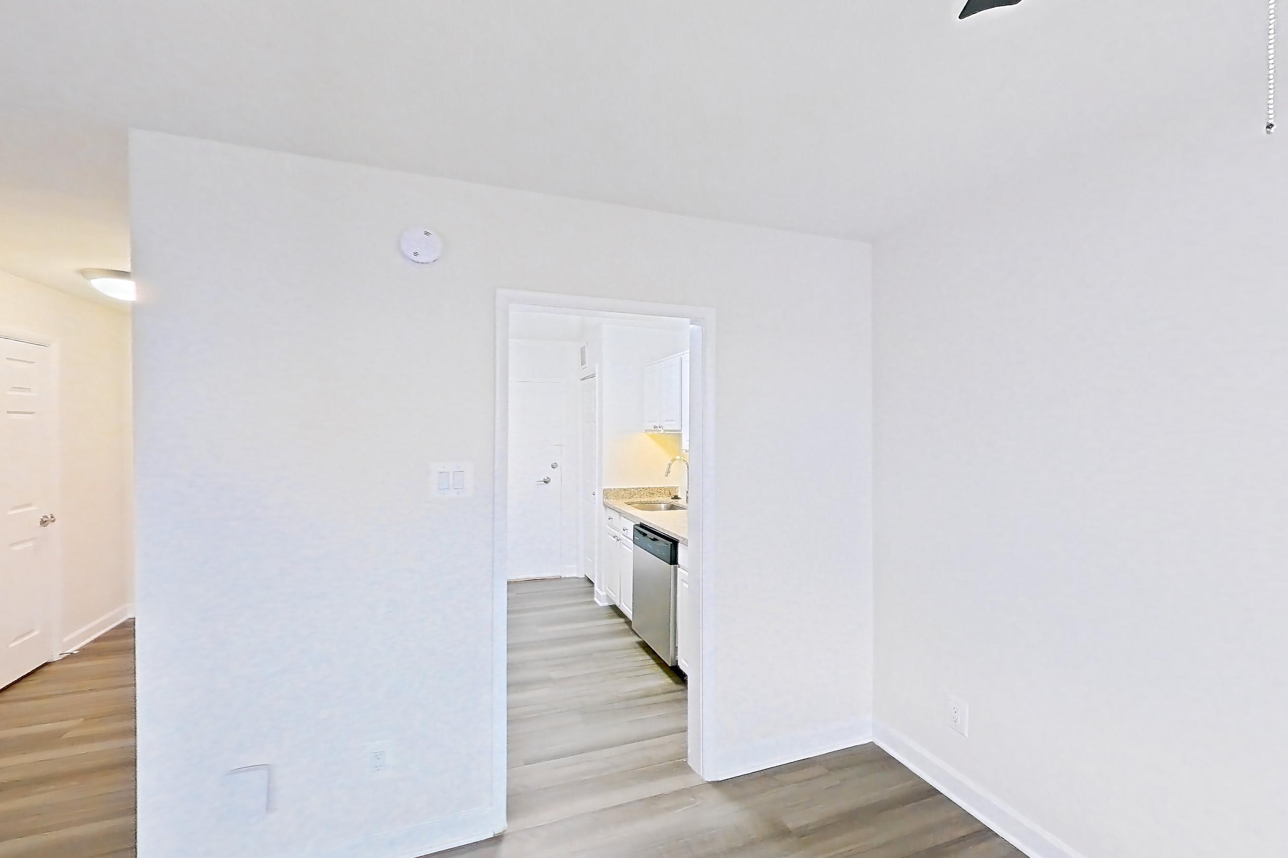 Dining room with dishwasher and stainless steel appliances, Apartment S-803 at Cortland on Pike