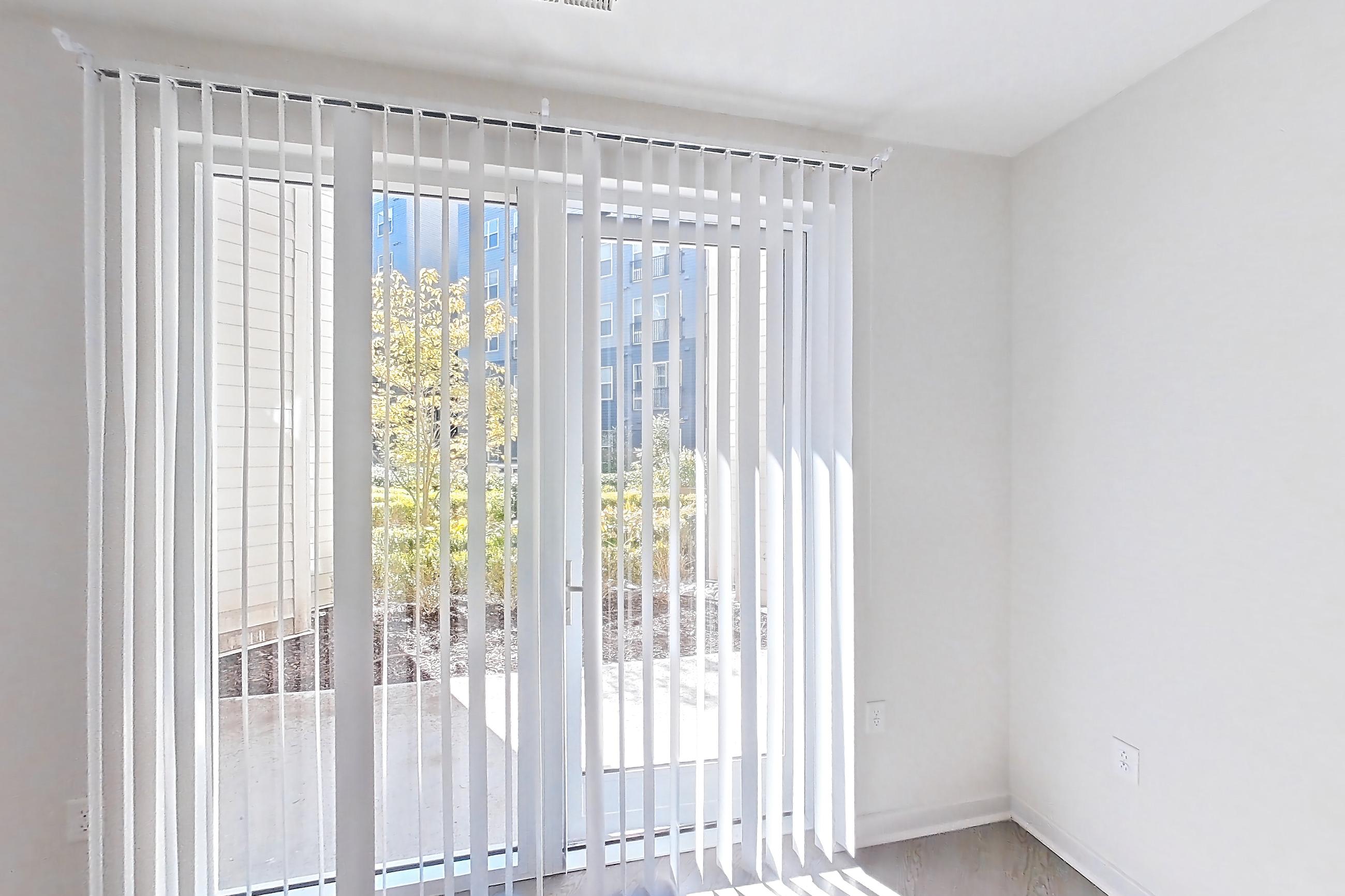 Living room with light wood-finish flooring, Apartment 159 at Cortland Columbia Pike