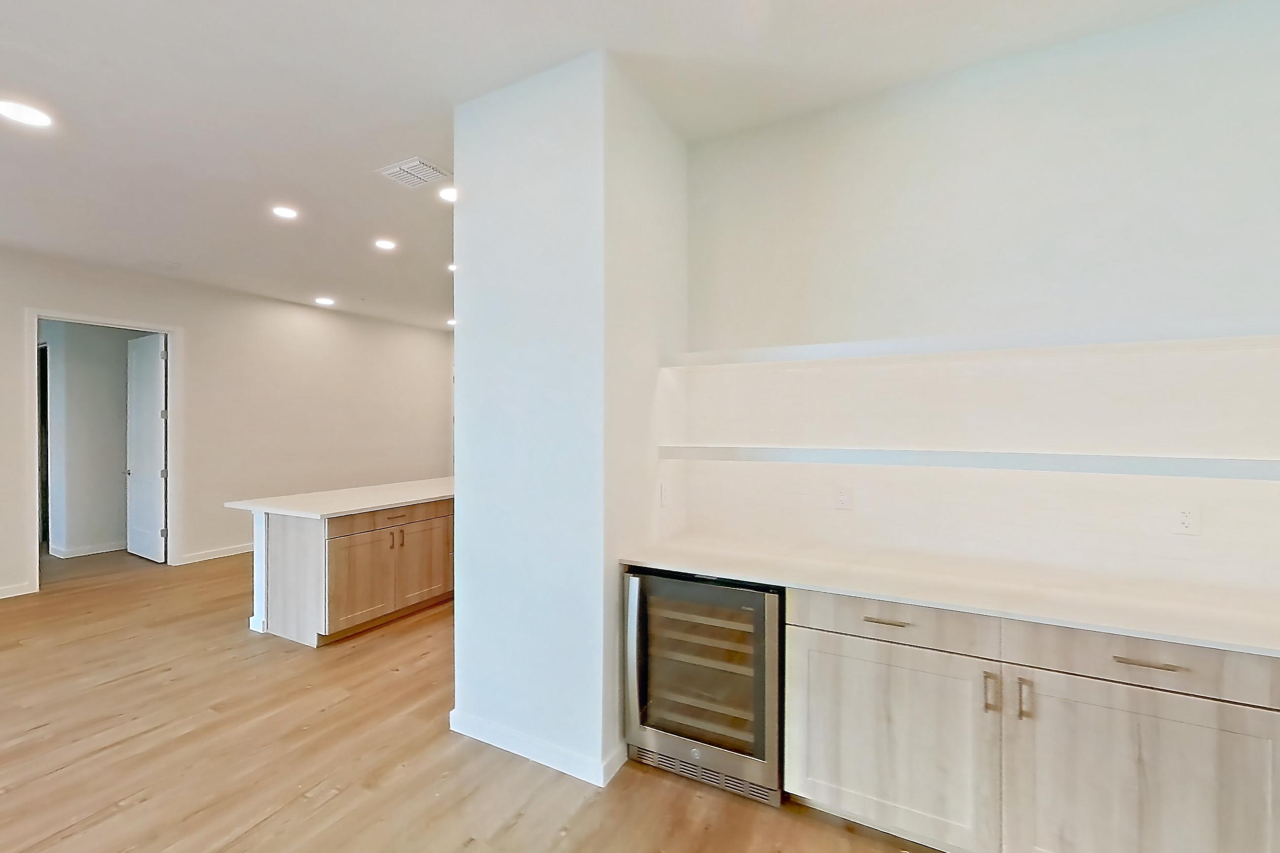 Dining room with light countertops and light wood-finish flooring, Apartment 242 at Lantower Bayside