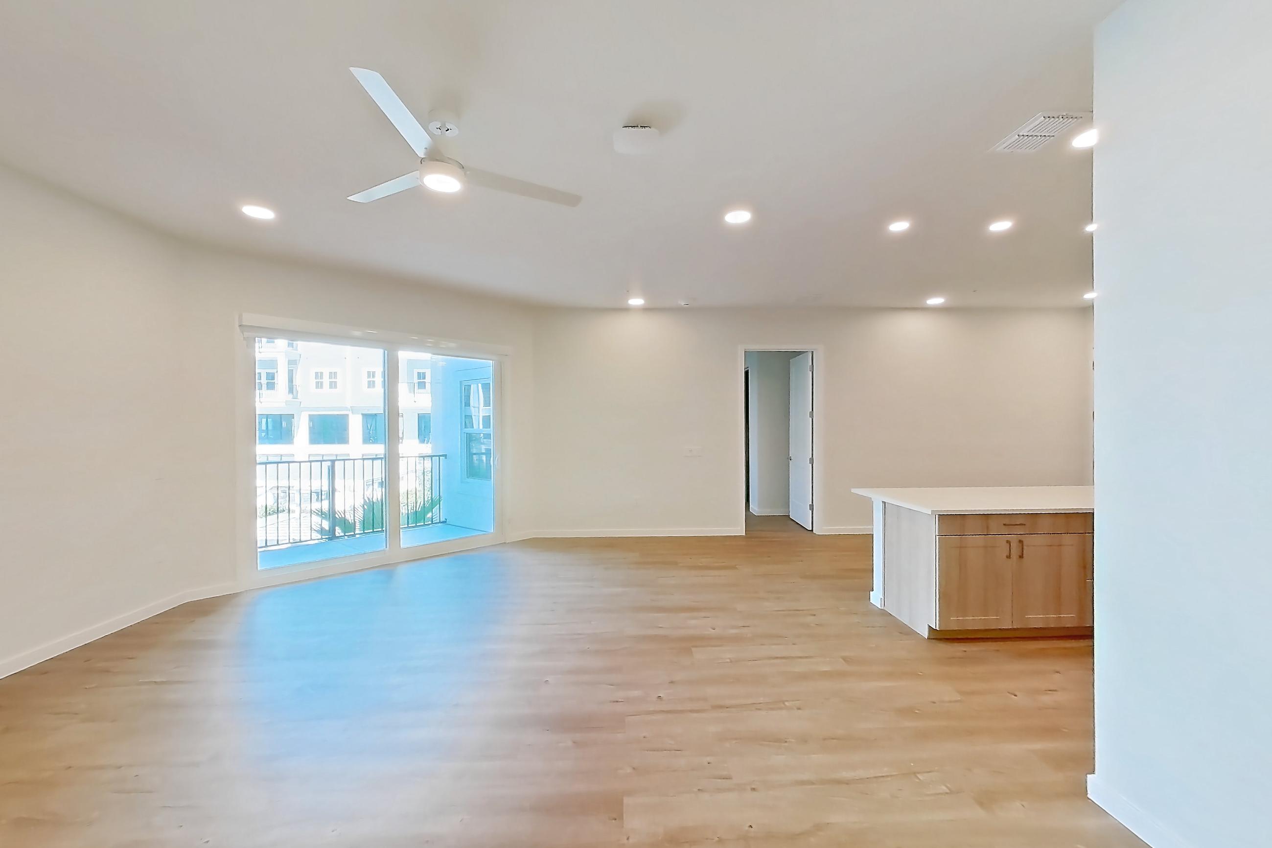 Dining room with light countertops and light wood-finish flooring, Apartment 242 at Lantower Bayside