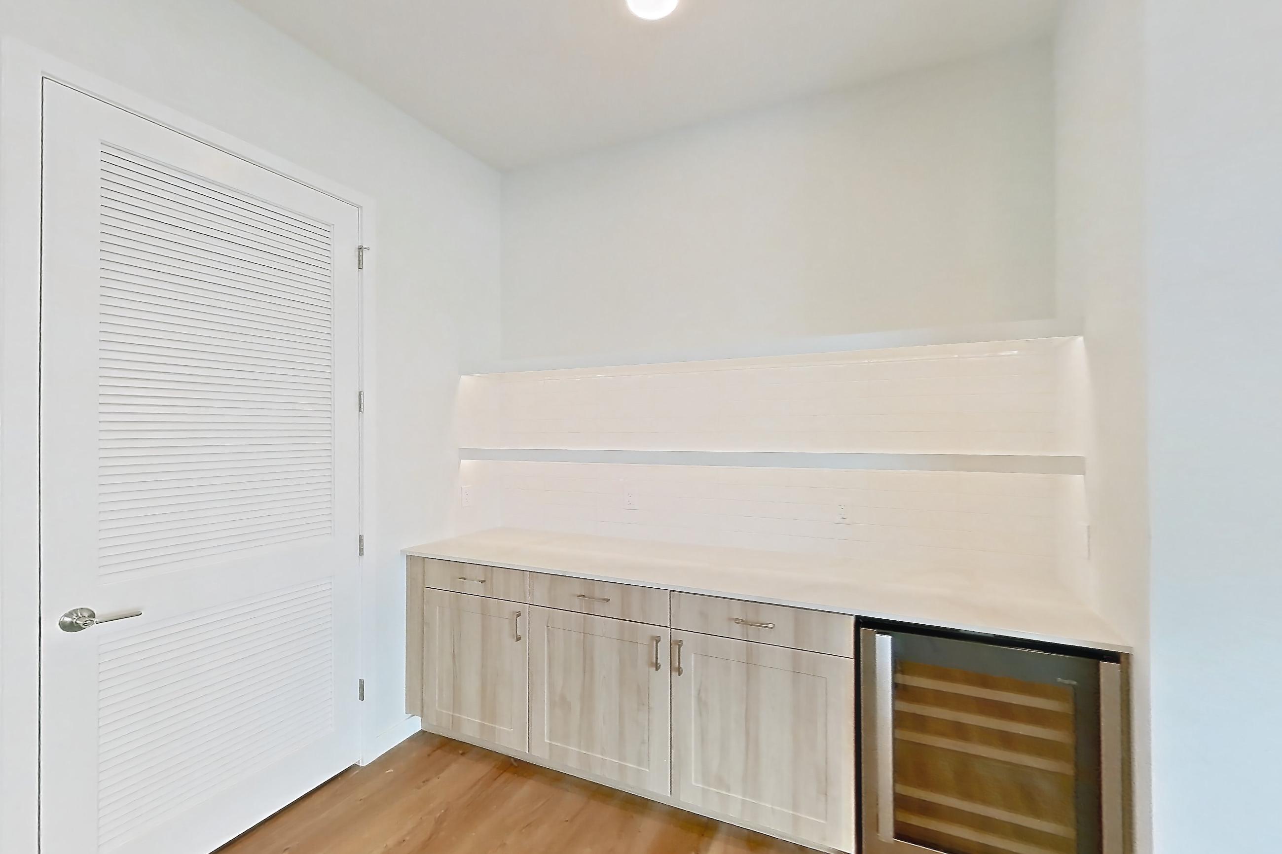Dining room with light countertops and light wood-finish flooring, Apartment 256 at Lantower Bayside