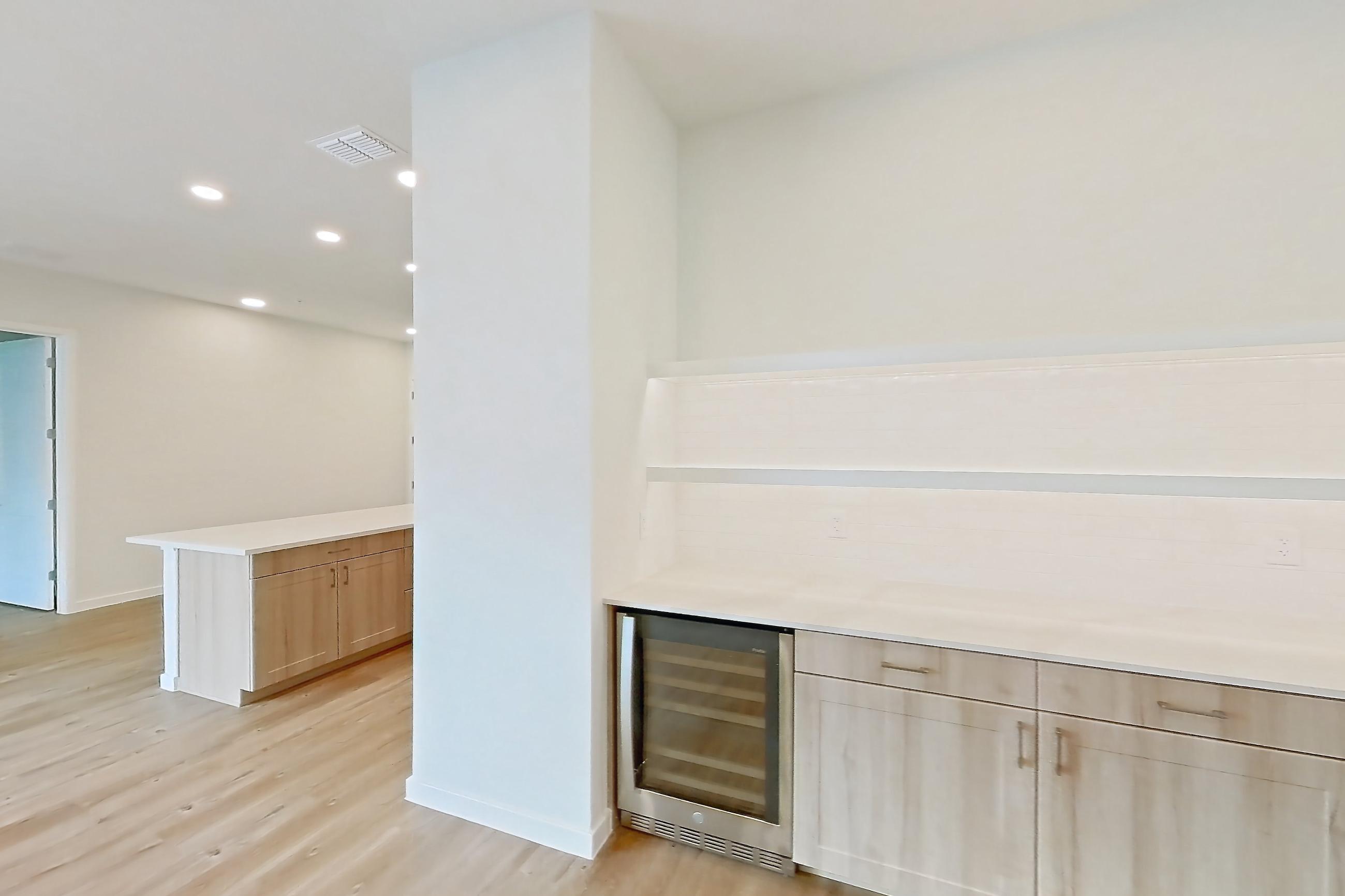 Dining room with light countertops and light wood-finish flooring, Apartment 332 at Lantower Bayside