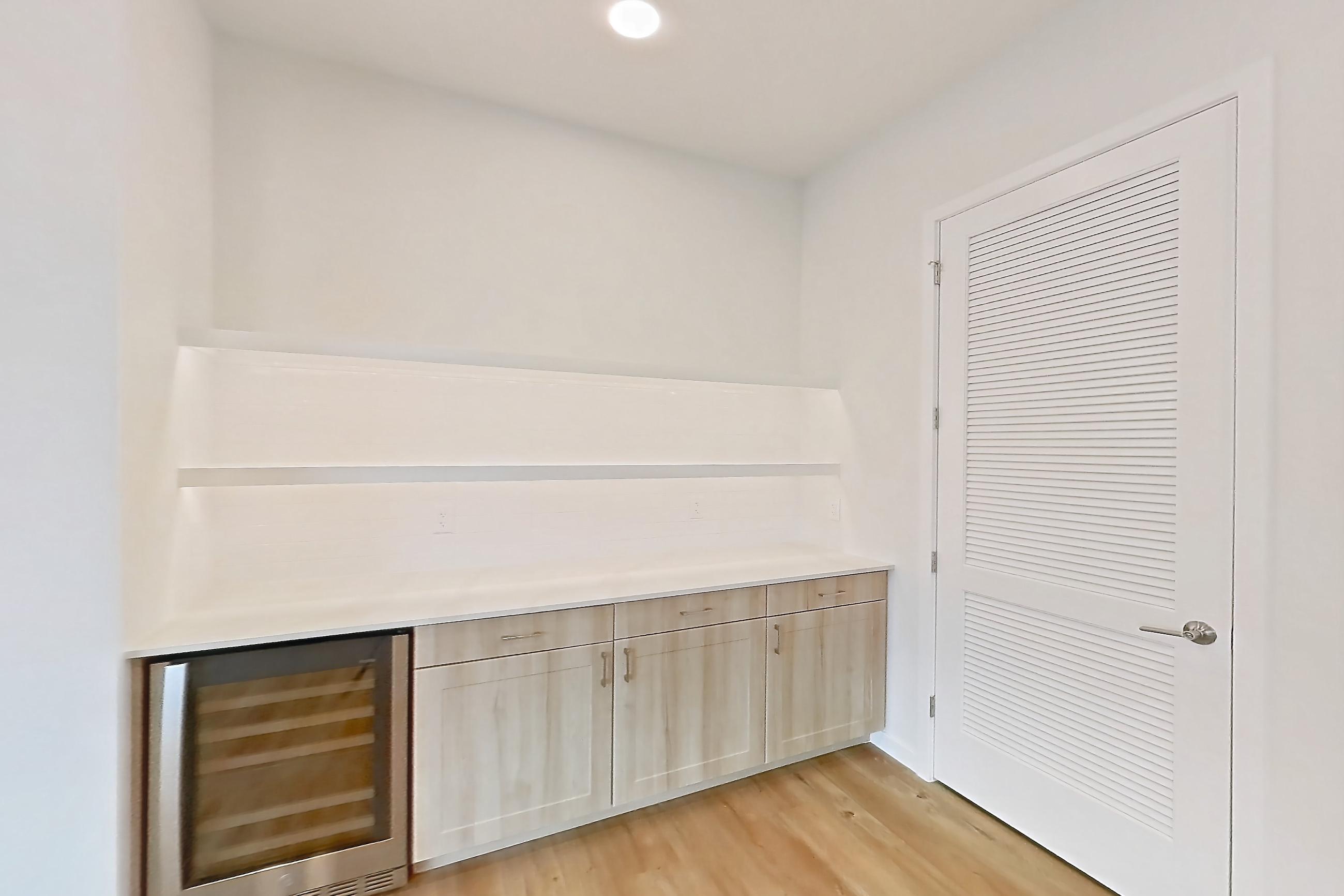 Dining room with light countertops and light wood-finish flooring, Apartment 474 at Lantower Bayside
