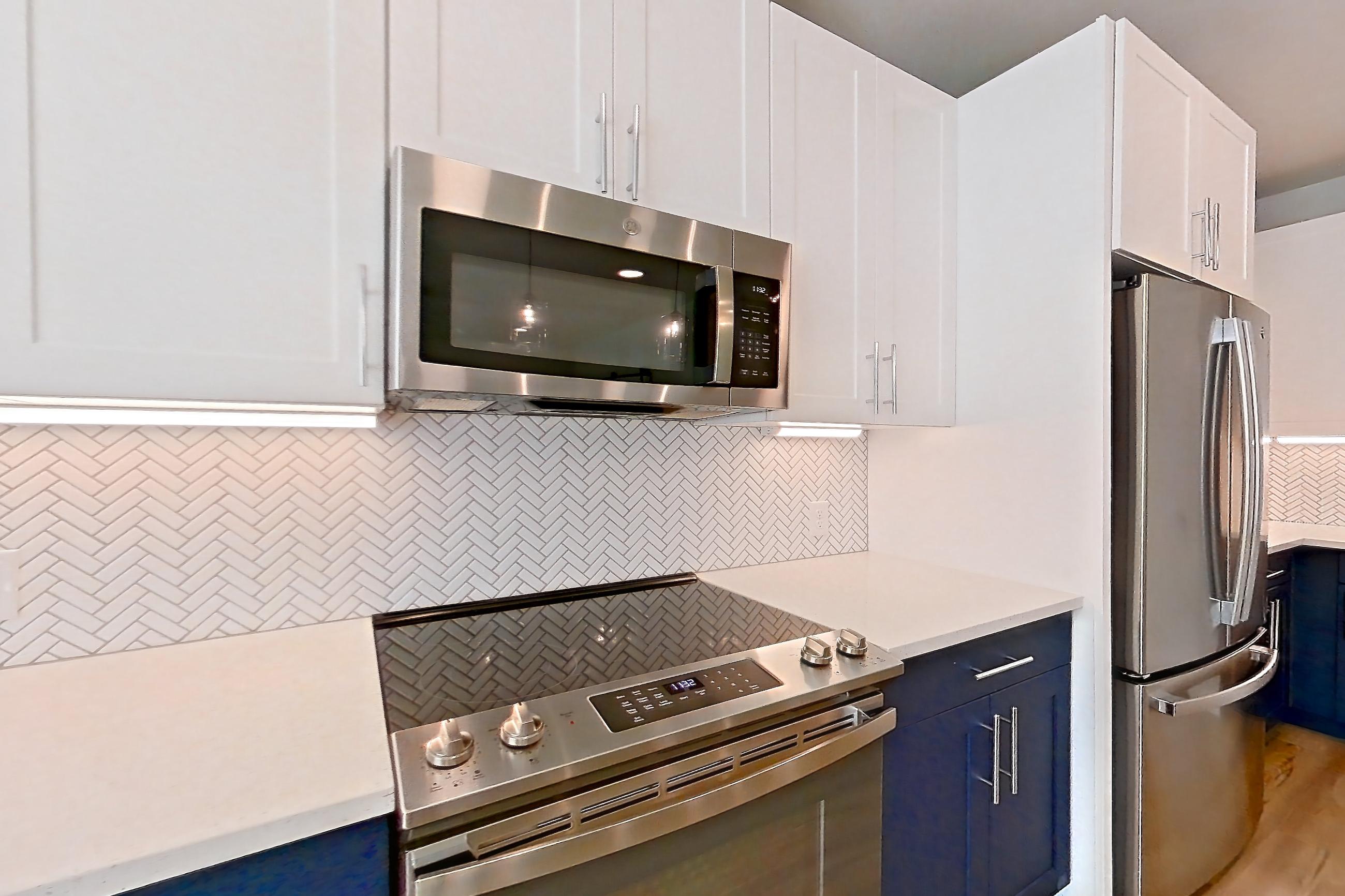 Kitchen in Apartment 2219 at Bridge at The Blockyard, 1E floor plan