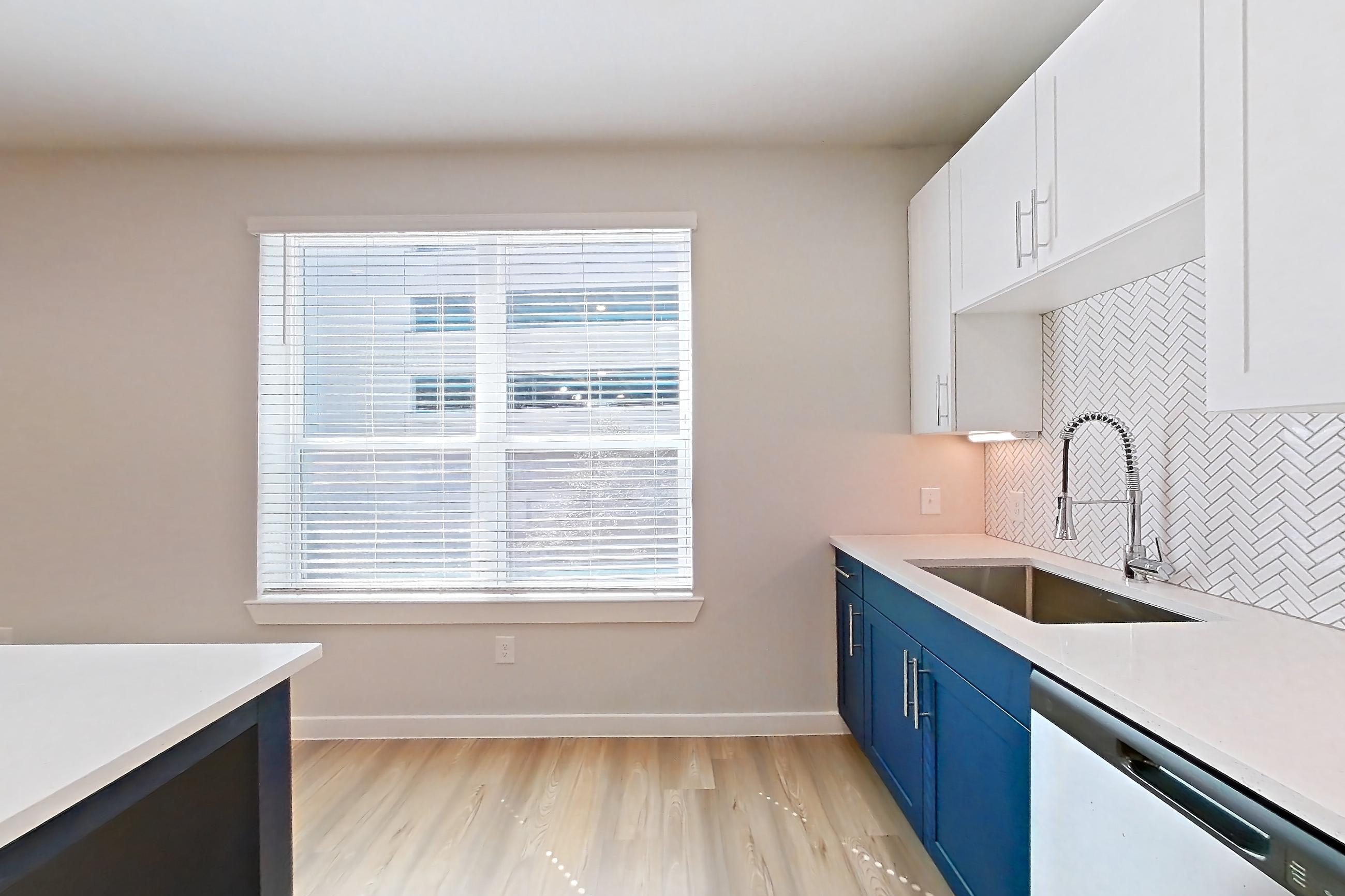 Kitchen in Apartment 2219 at Bridge at The Blockyard, 1E floor plan