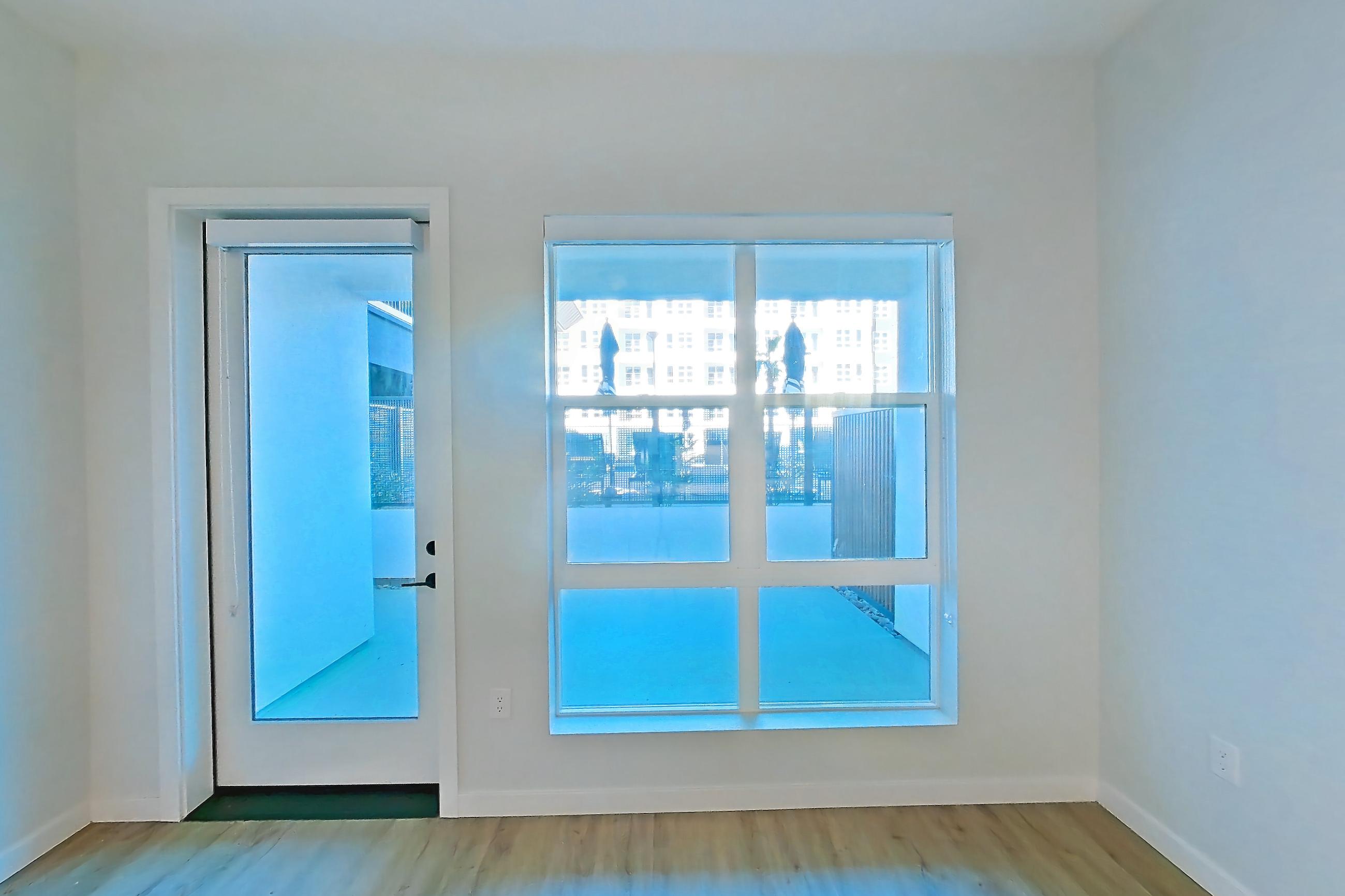 Living room with light wood-finish flooring, Apartment 334 at Gemma
