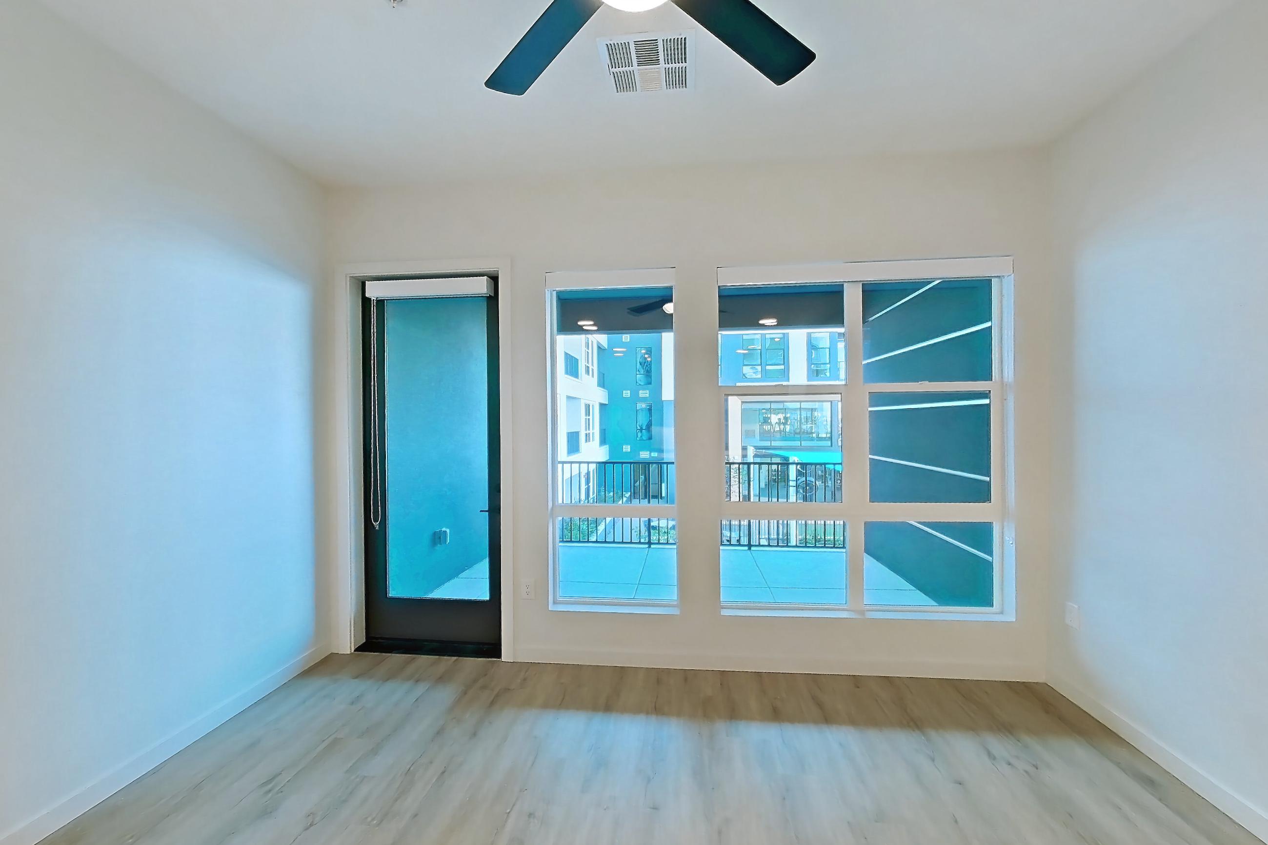 Living room with light wood-finish flooring, Apartment 404 at Gemma