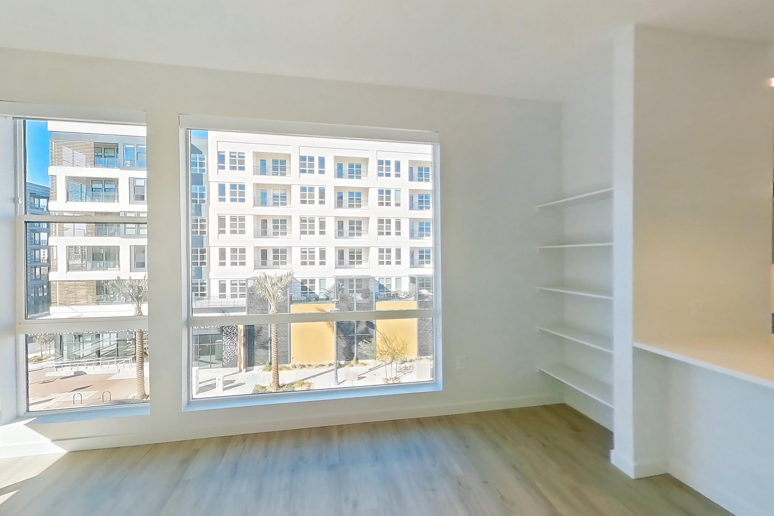 Living room with light wood-finish flooring, Apartment 402 at Gemma