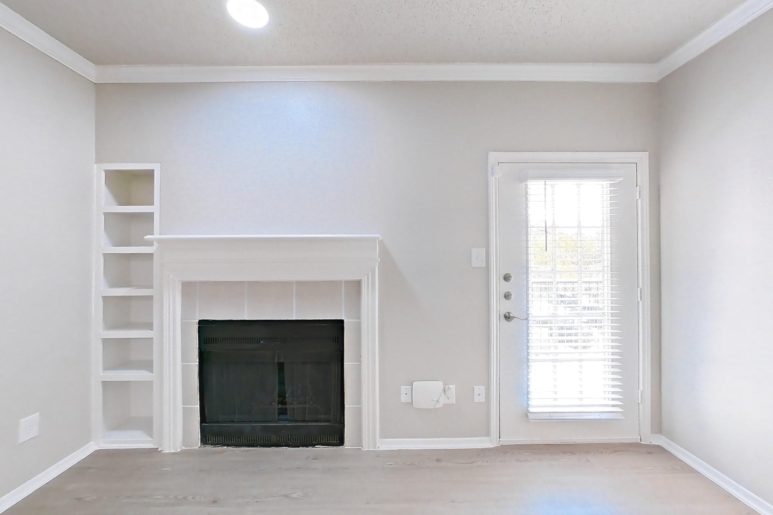 Living space with fireplace, light wood-finish flooring, and tile fireplace, Apartment 228 at Museo and Channings Mark