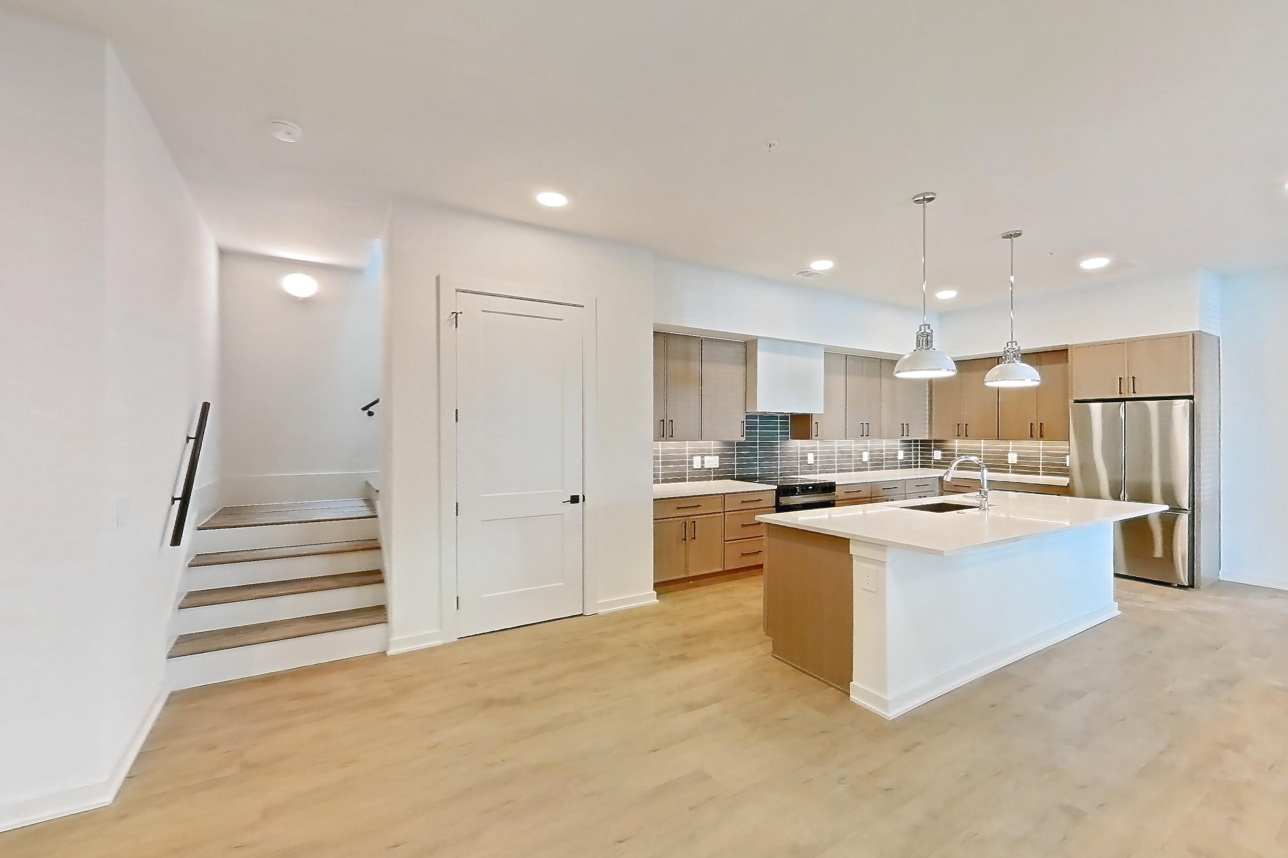 Living room with light wood-finish flooring, Apartment 1101 at Cortland Galleria