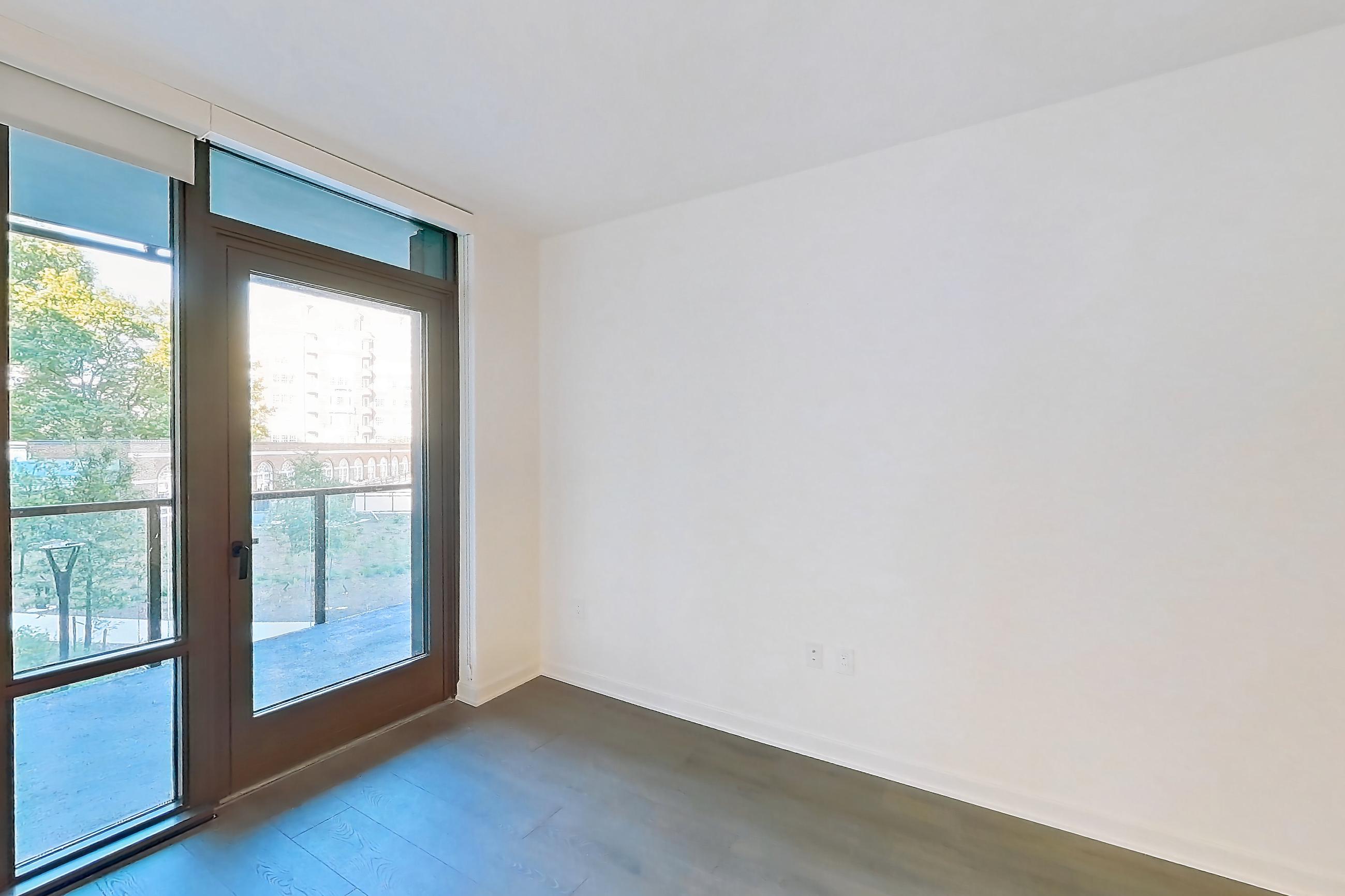 Living room with light wood-finish flooring, Apartment 0217 at Aerie