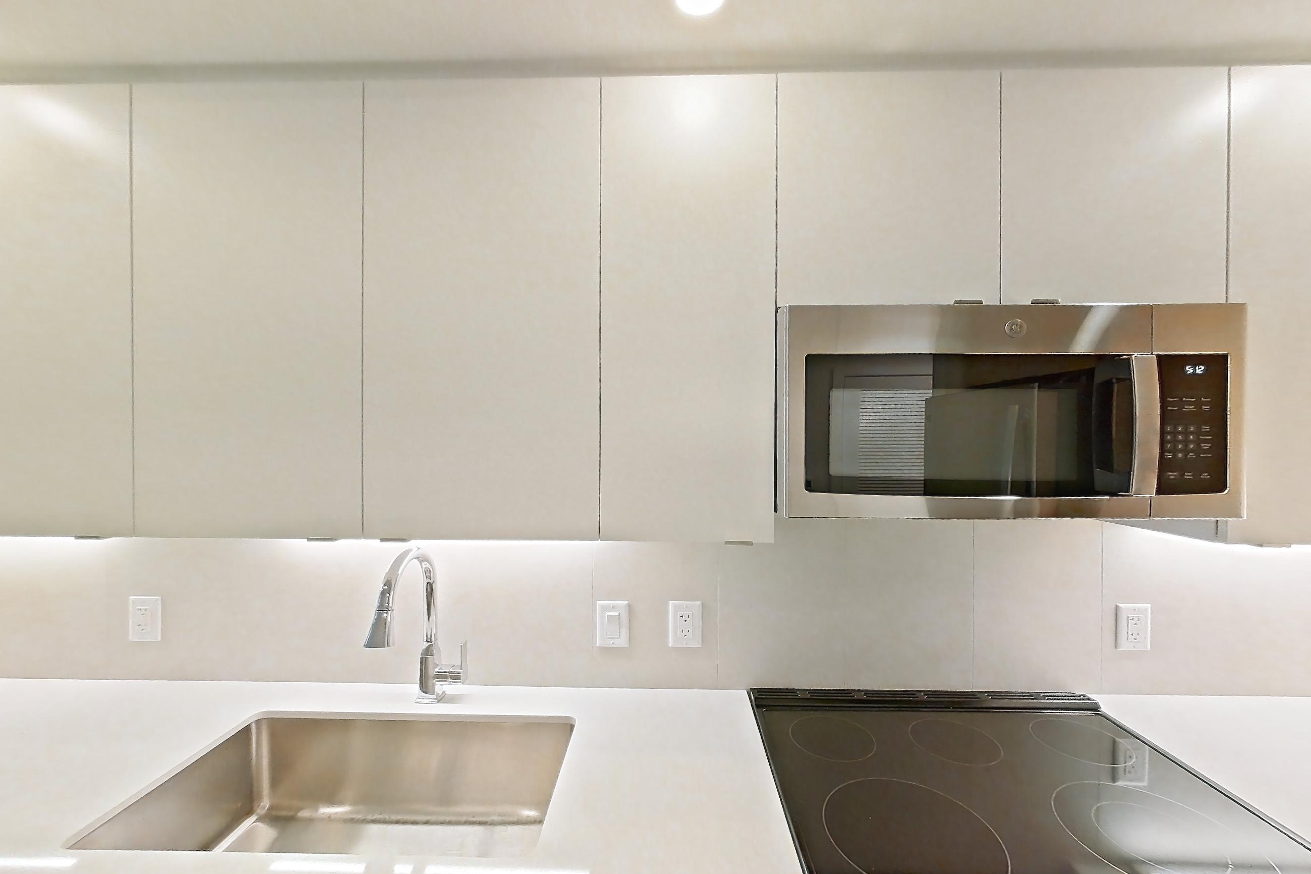 Kitchen in Apartment 107 at Caroline Pompano Beach, A3 floor plan