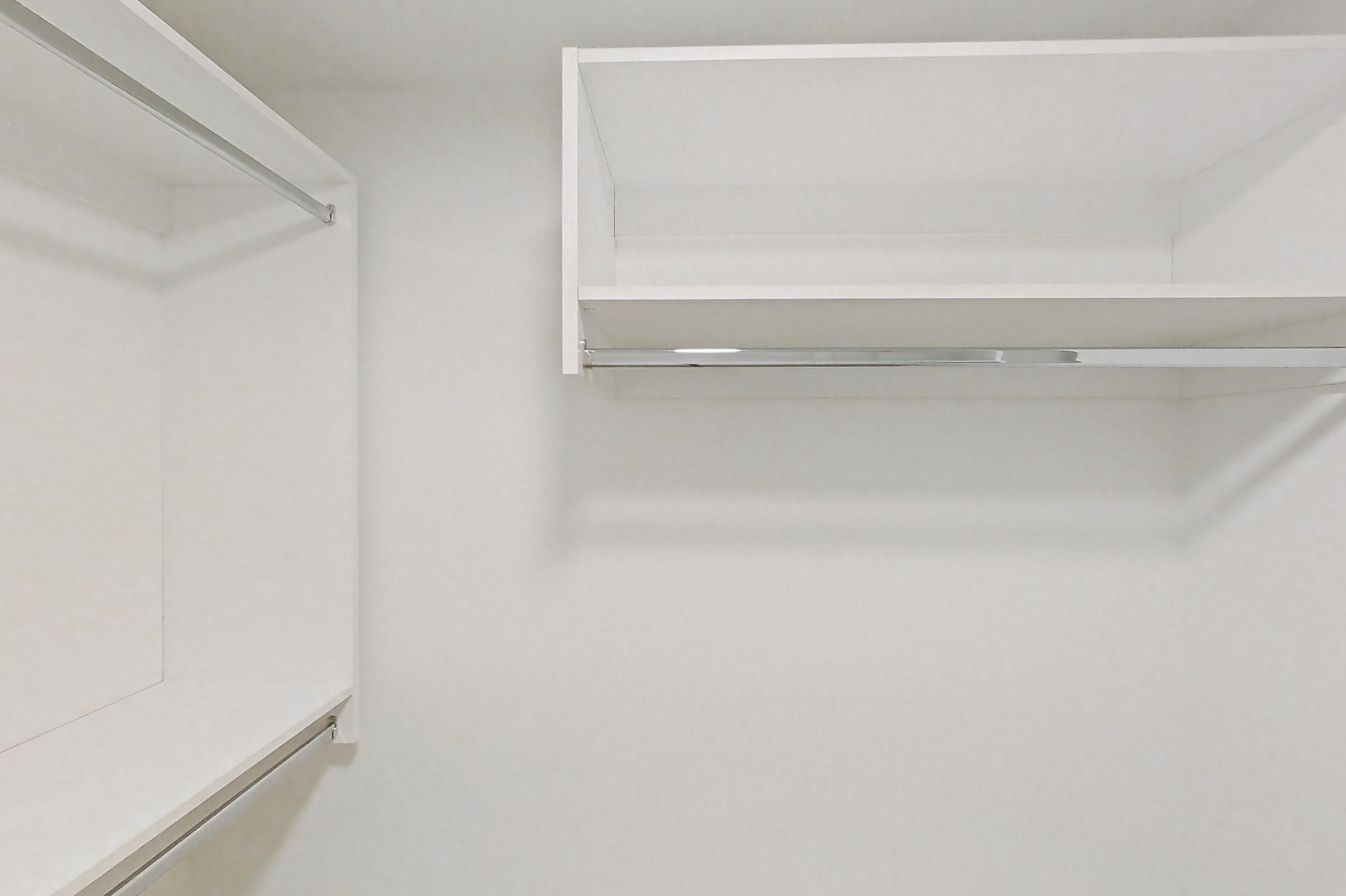 Living space closet with light wood-finish flooring, Apartment 109 at Caroline Pompano Beach