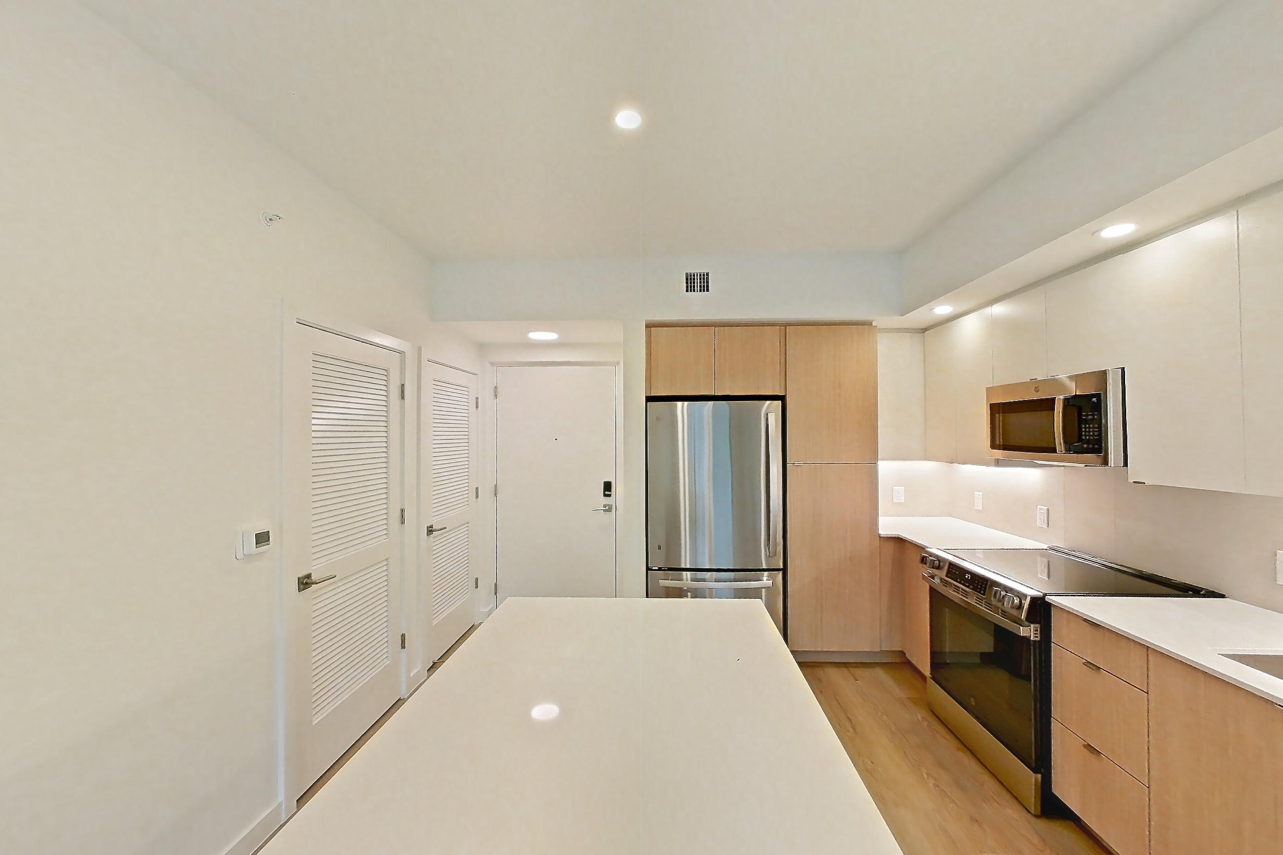 Kitchen island corner in Apartment 202 at Caroline Pompano Beach, A1 floor plan