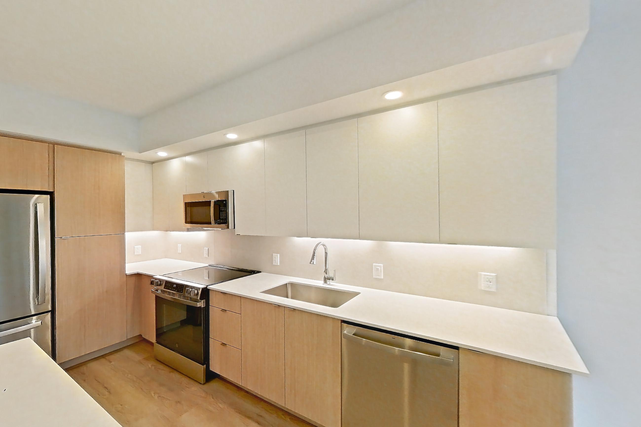 Kitchen island corner in Apartment 202 at Caroline Pompano Beach, A1 floor plan