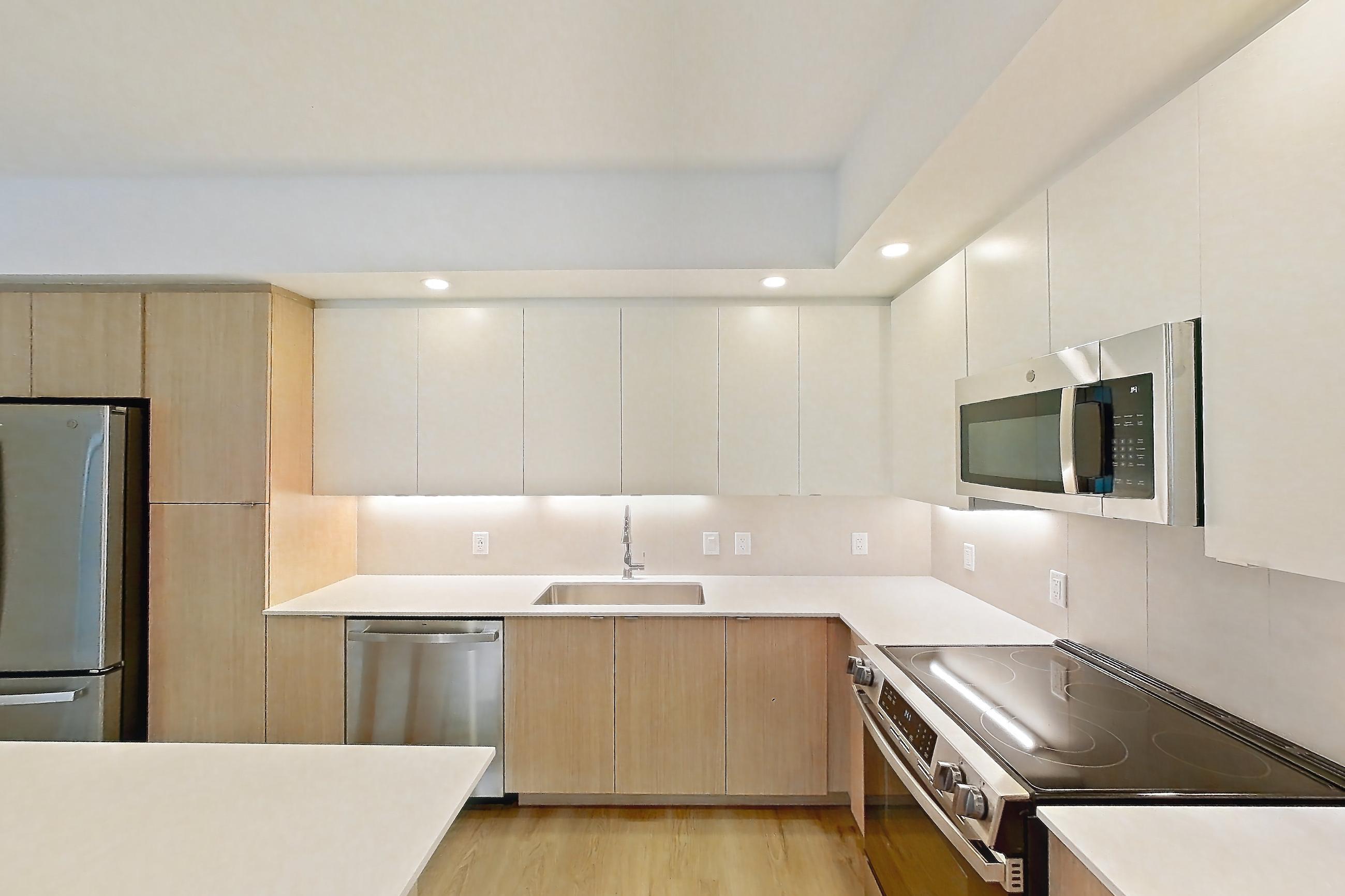 Kitchen island corner in Apartment 203 at Caroline Pompano Beach, B1 floor plan