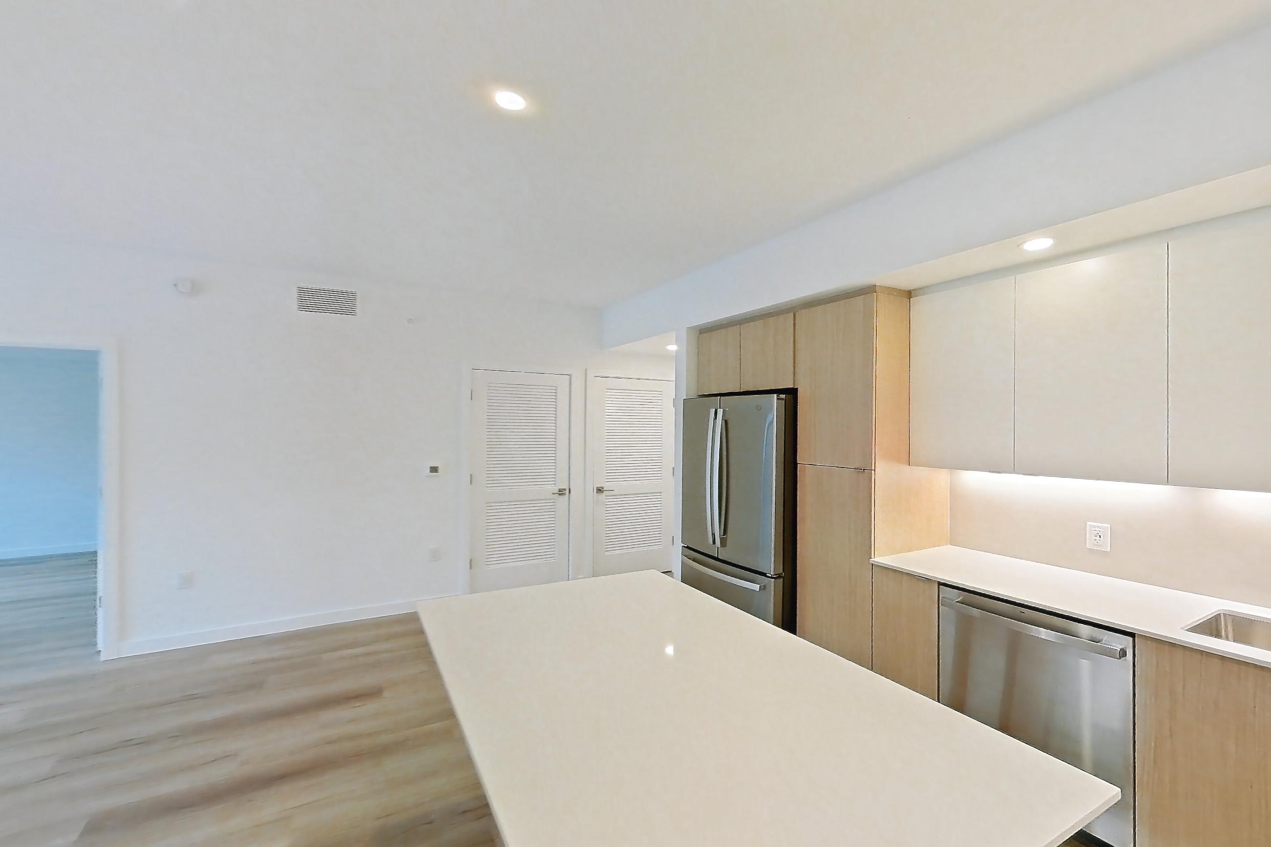 Kitchen island corner in Apartment 203 at Caroline Pompano Beach, B1 floor plan
