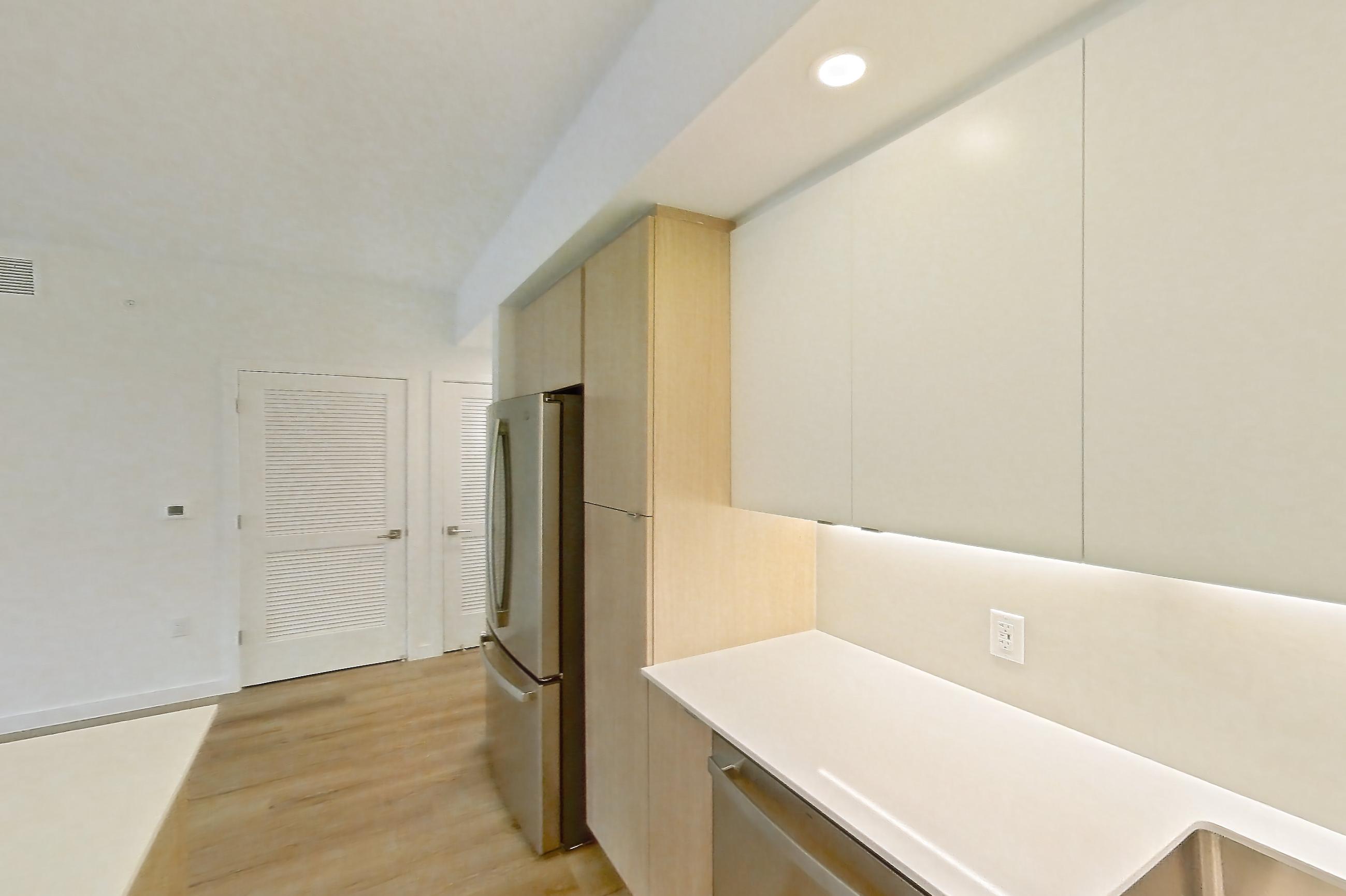 Kitchen in Apartment 203 at Caroline Pompano Beach, B1 floor plan