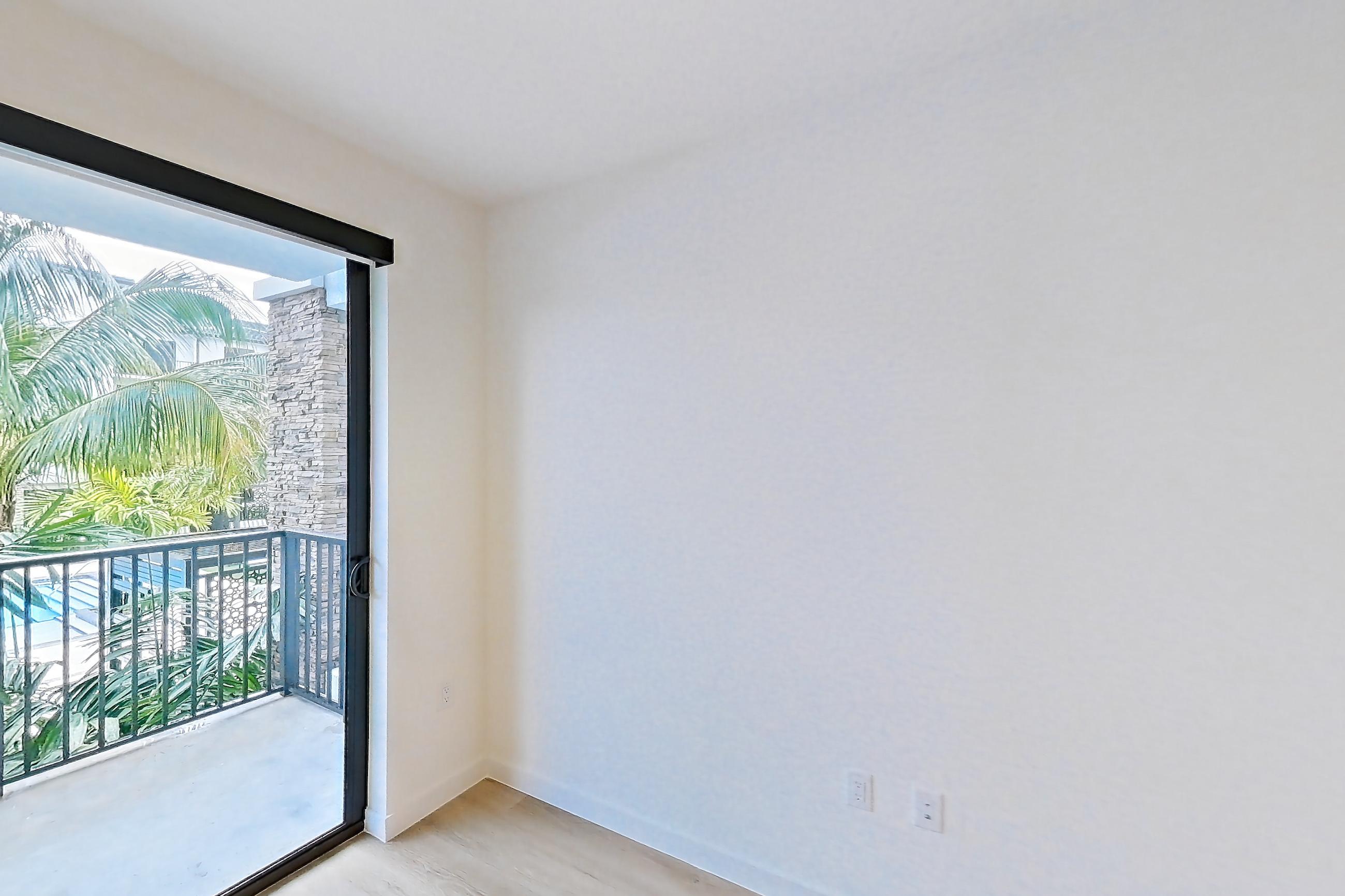 Living room in Apartment 203 at Caroline Pompano Beach, B1 floor plan