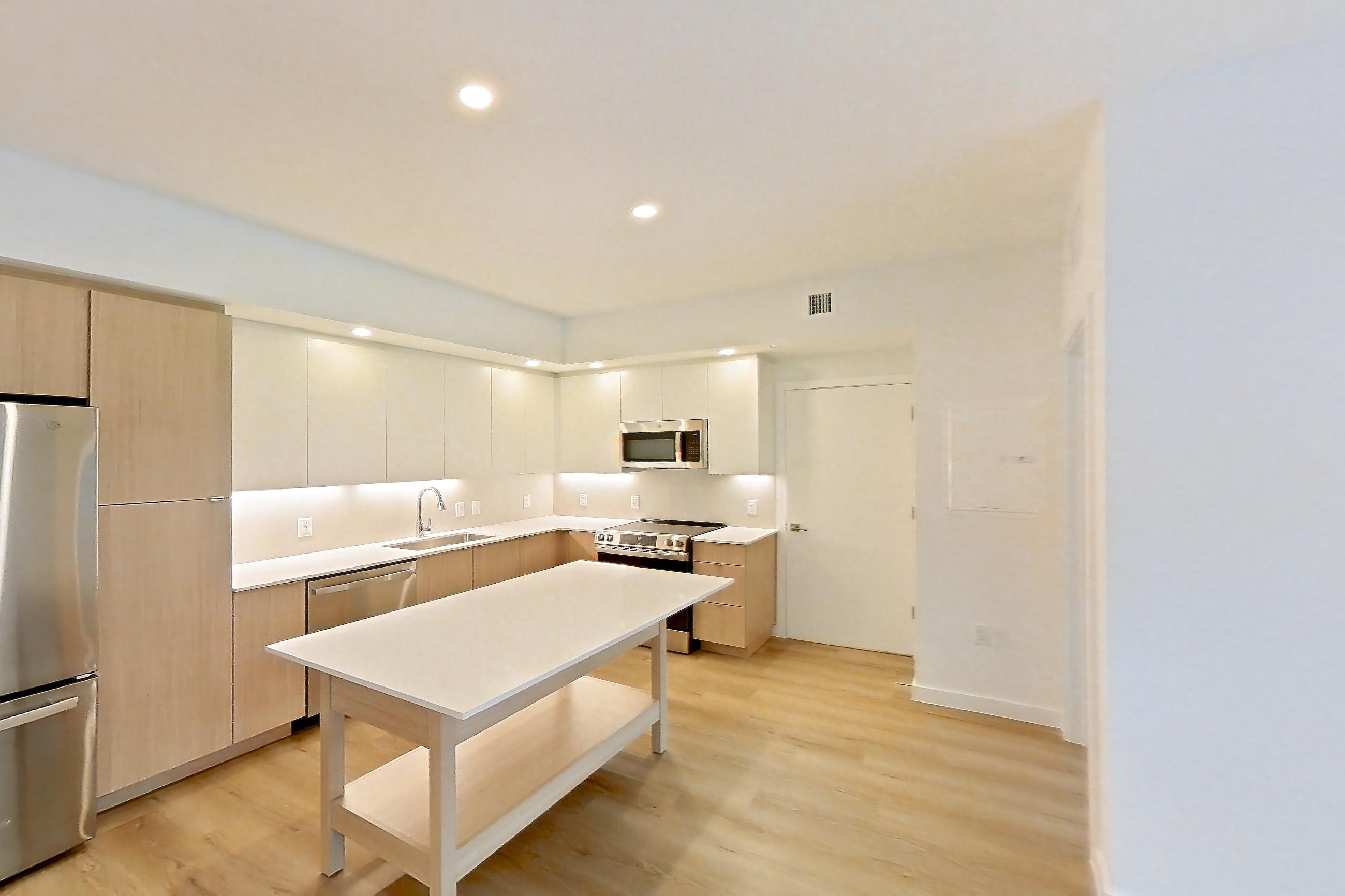 Living space in Apartment 203 at Caroline Pompano Beach, B1 floor plan