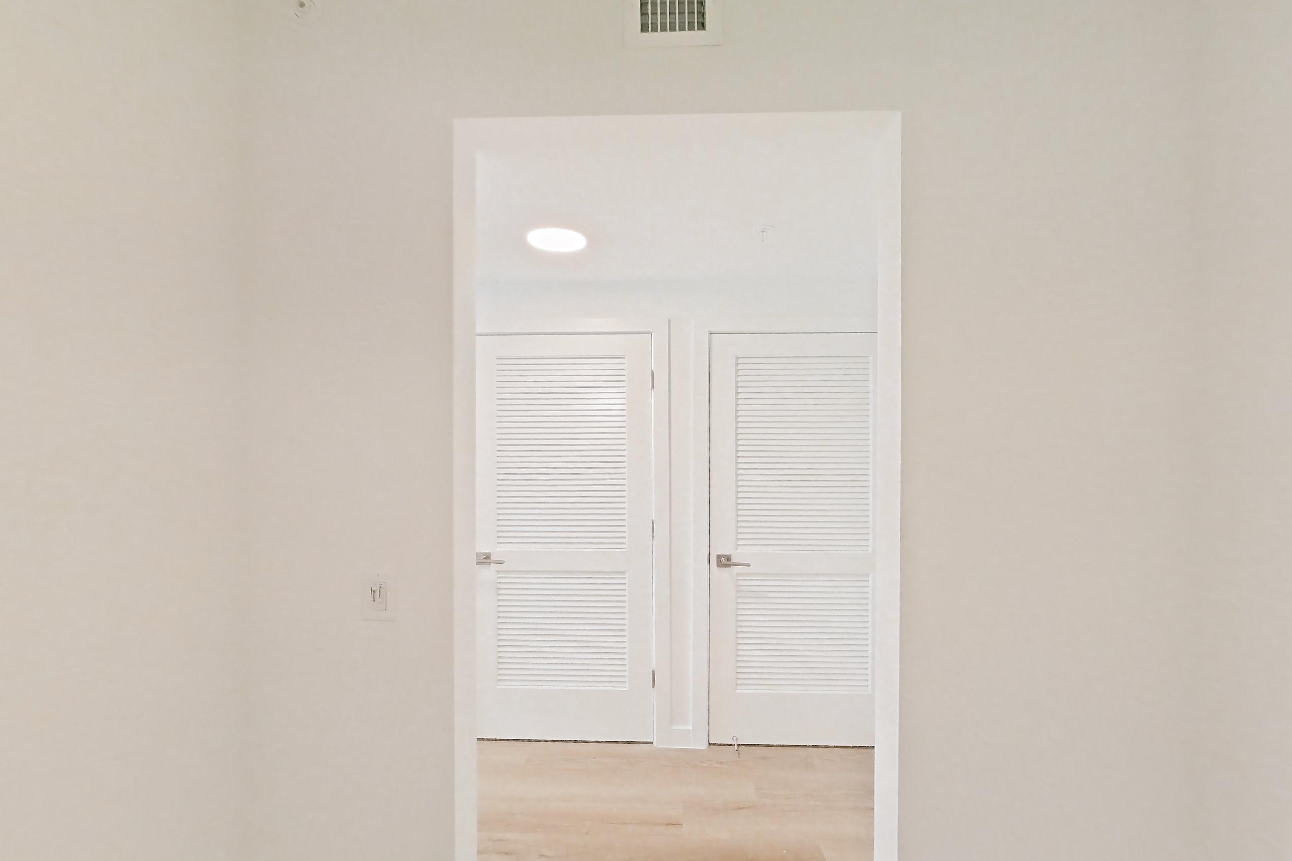 Entryway living space in Apartment 204 at Caroline Pompano Beach, A2 floor plan