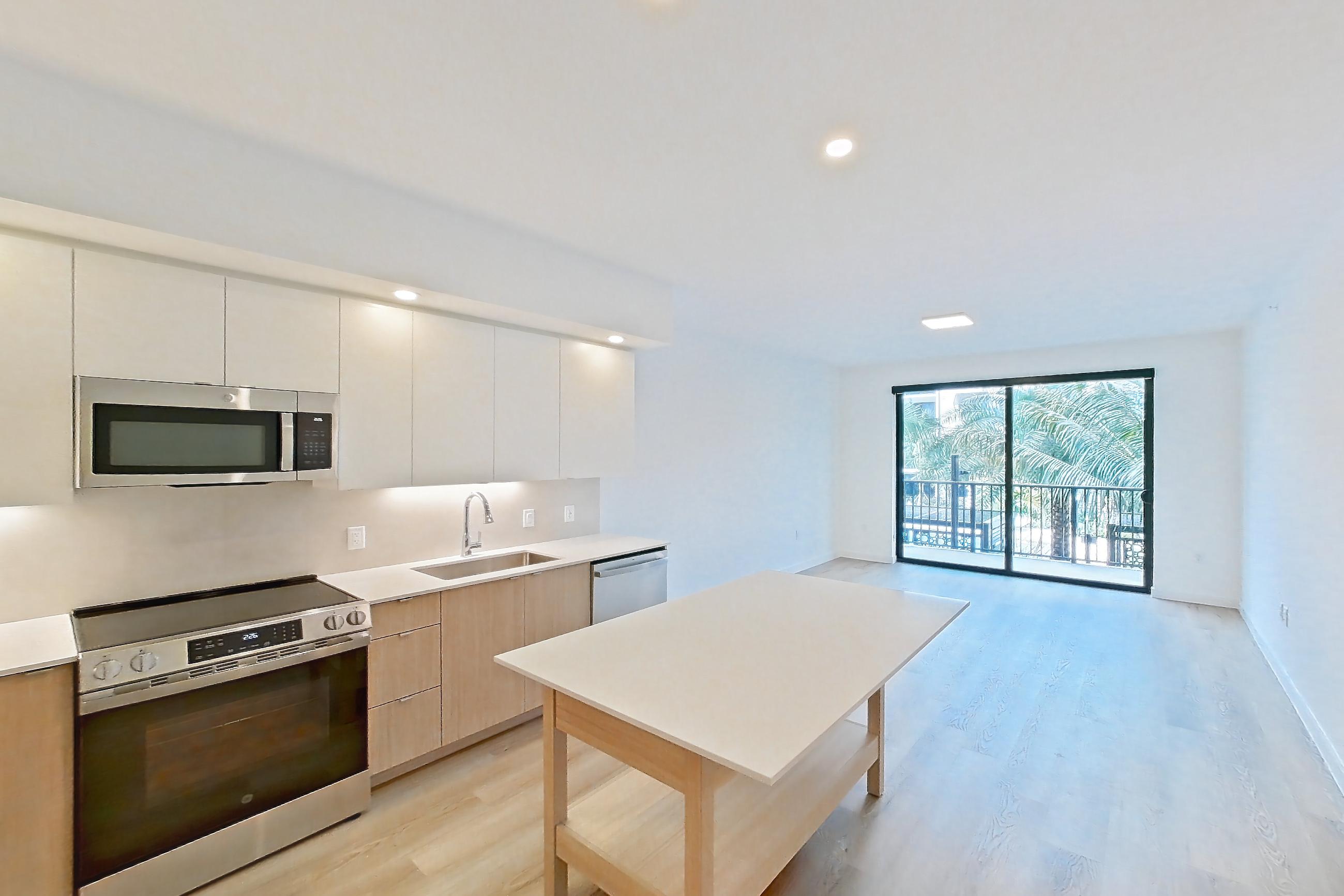 Kitchen entryway in Apartment 204 at Caroline Pompano Beach, A2 floor plan