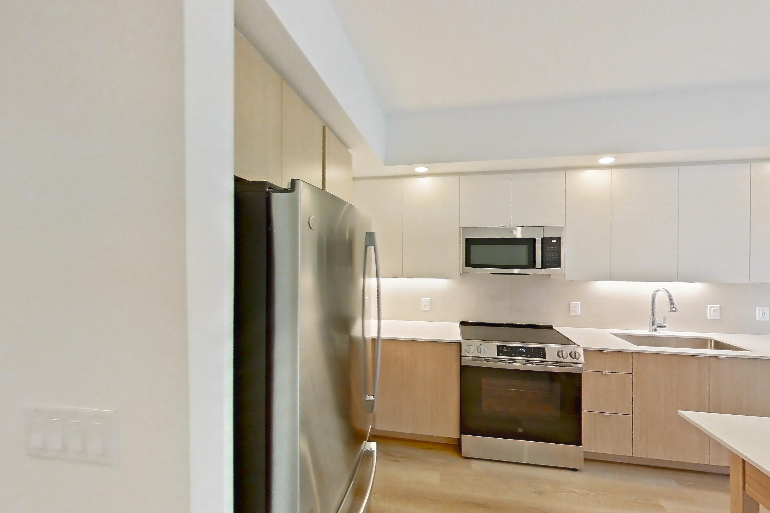 Kitchen entryway in Apartment 204 at Caroline Pompano Beach, A2 floor plan