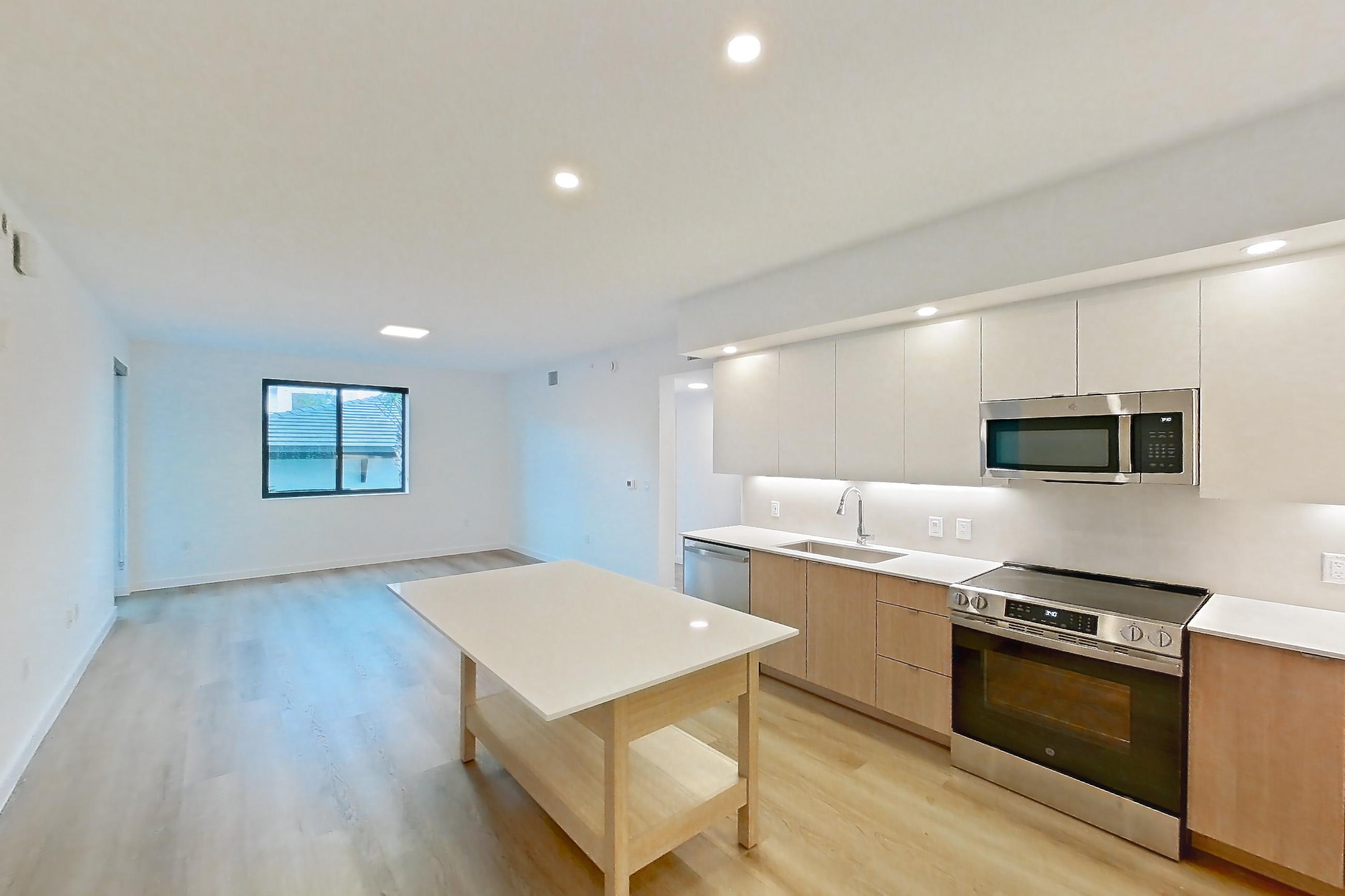 Kitchen entryway in Apartment 206 at Caroline Pompano Beach, C1 floor plan