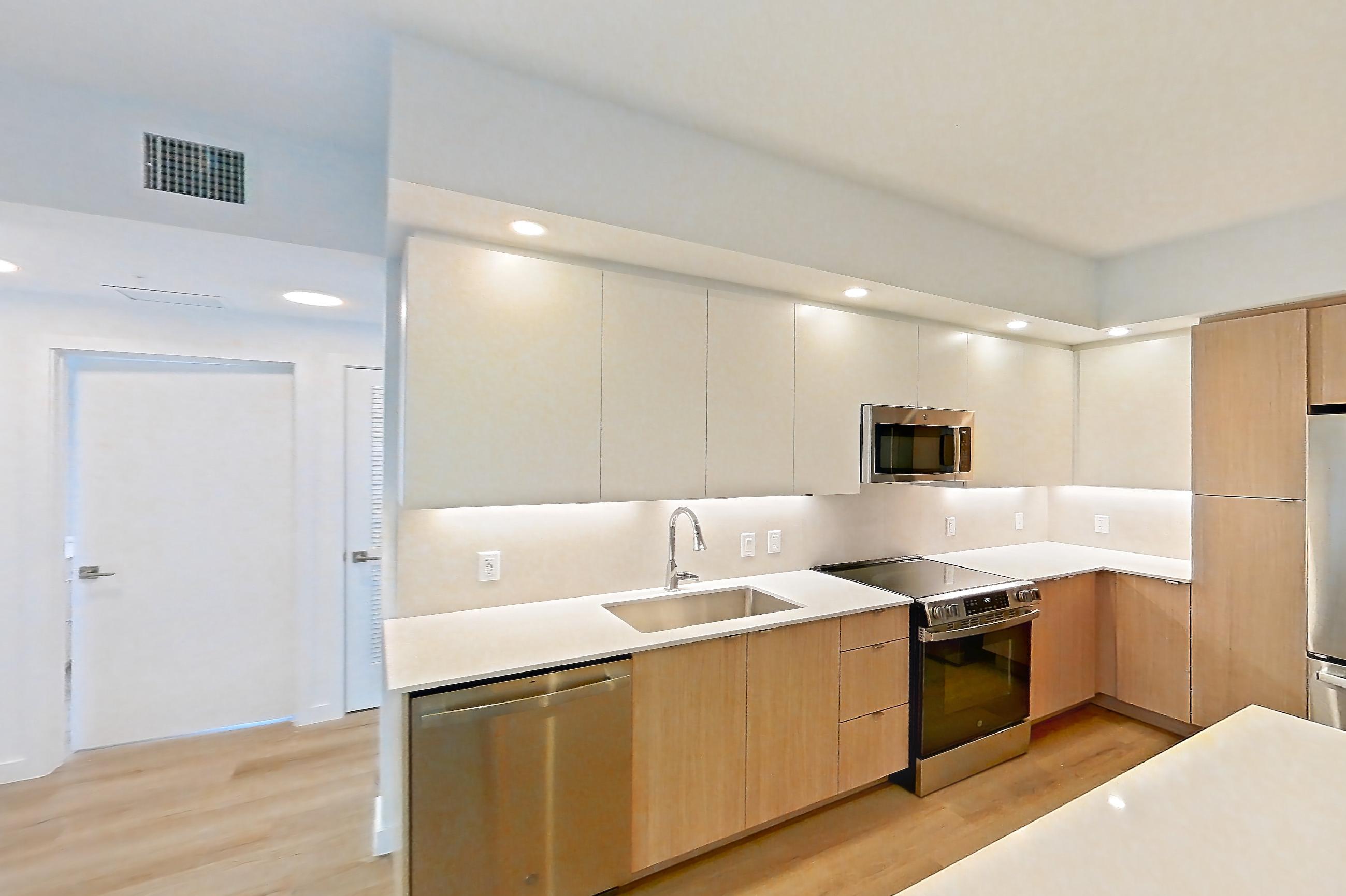Kitchen island corner in Apartment 206 at Caroline Pompano Beach, C1 floor plan