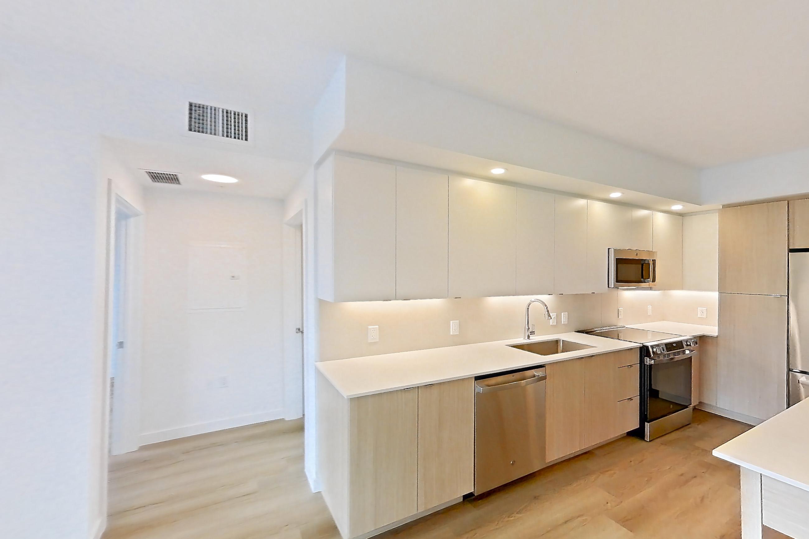 Living space in Apartment 207 at Caroline Pompano Beach, B2 floor plan