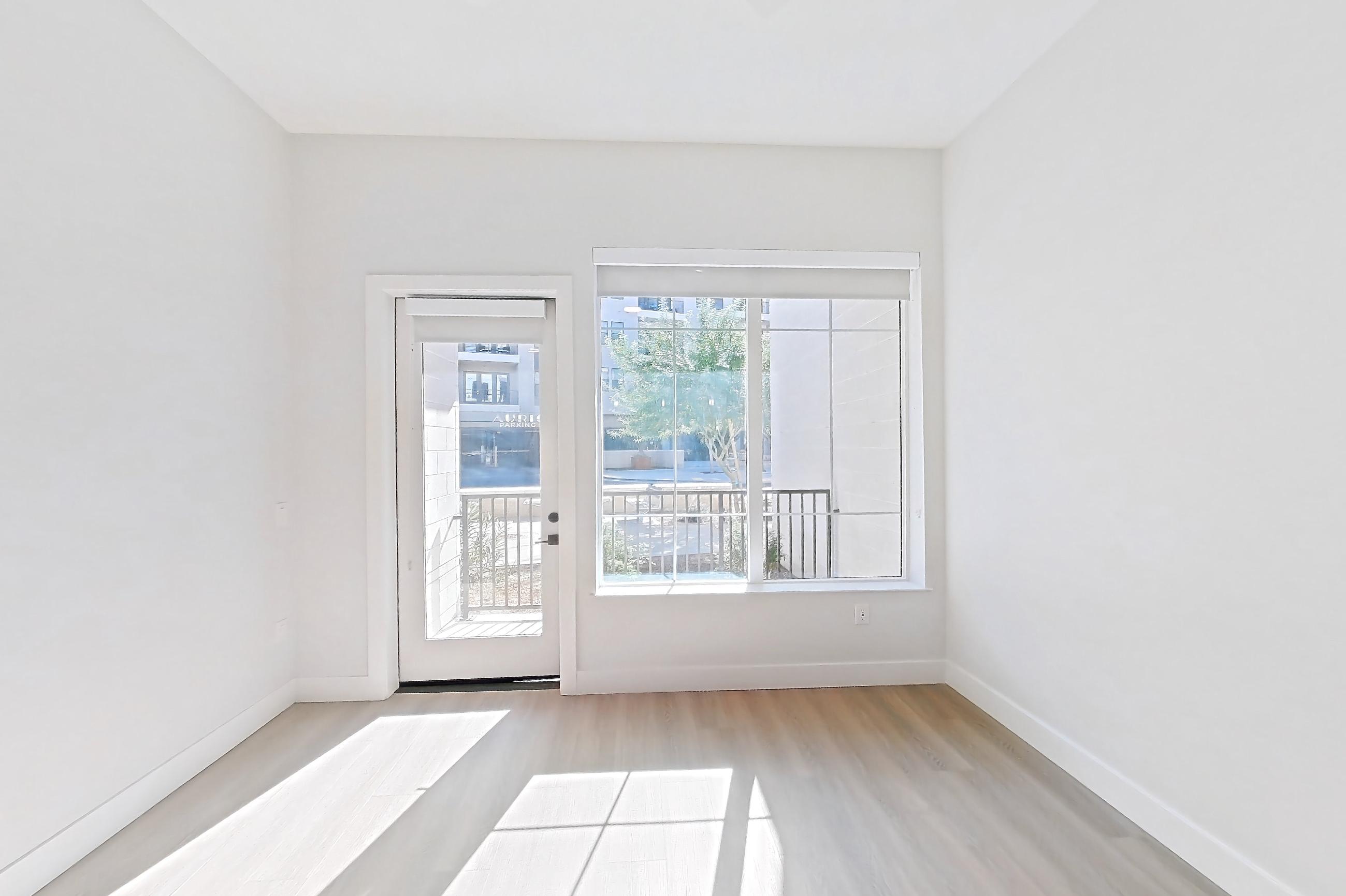 Living room with light wood-finish flooring, Apartment 120 at Bria