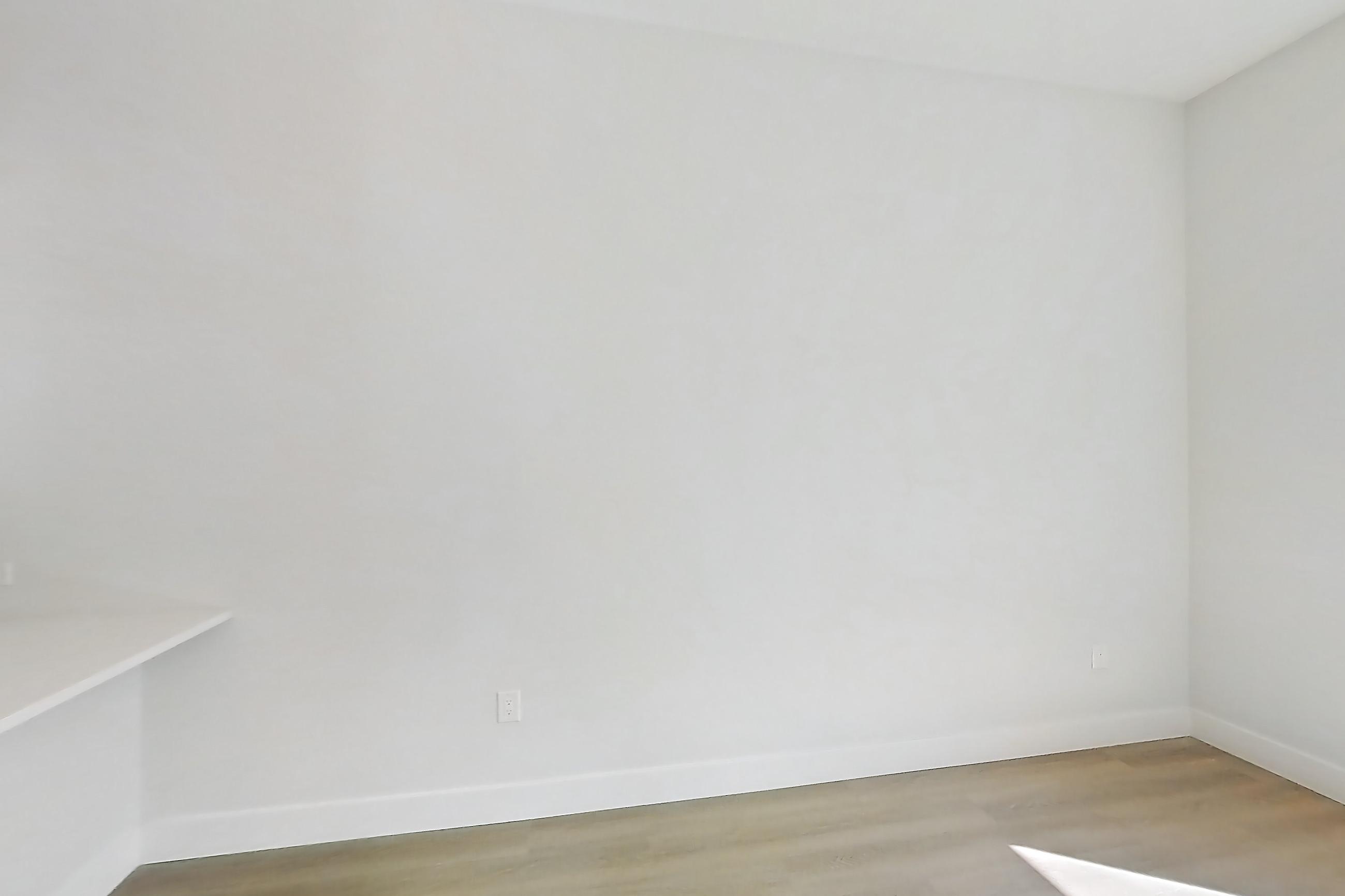 Living room with gas range, light wood-finish flooring, oven/range, and stainless steel appliances, Apartment 130 at Bria