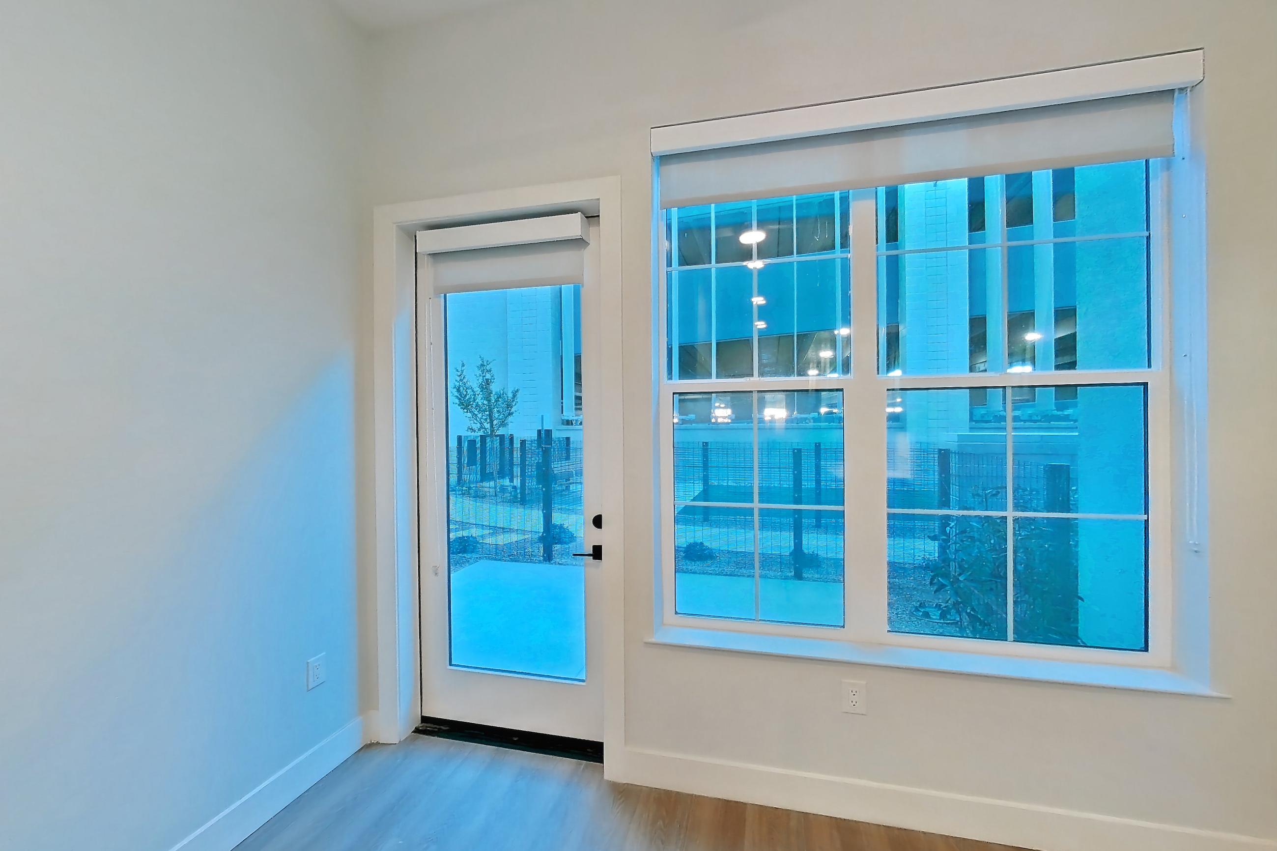 Living room with light wood-finish flooring, Apartment 113 at Bria